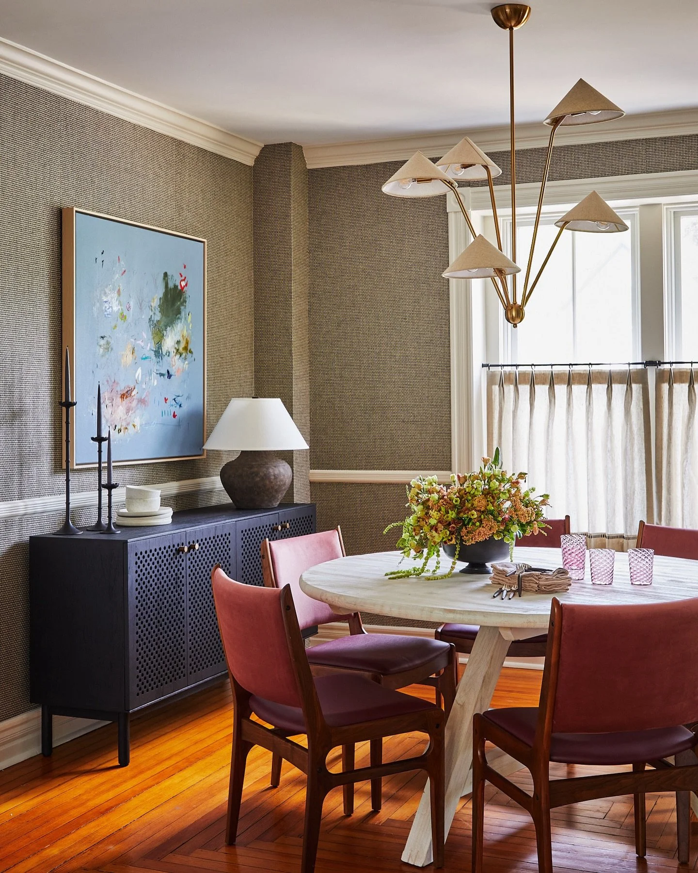 At our #Greenport project, where our clients have a love for midcentury, we paired 1950s dining chairs (reupholstered in a split fabric: velvet on the seat back and a coordinating faux leather on the seat) with a beachy feeling bleached pine dining t