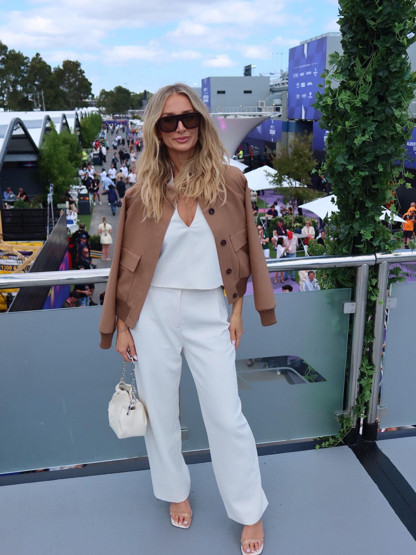 @annaheinrich1 at @ausgp 🏁. Wearing @sabastyle for the chequered flag, to raising a @cointreau_au margarita at @theemerson post- race 🤍. #22mgmt