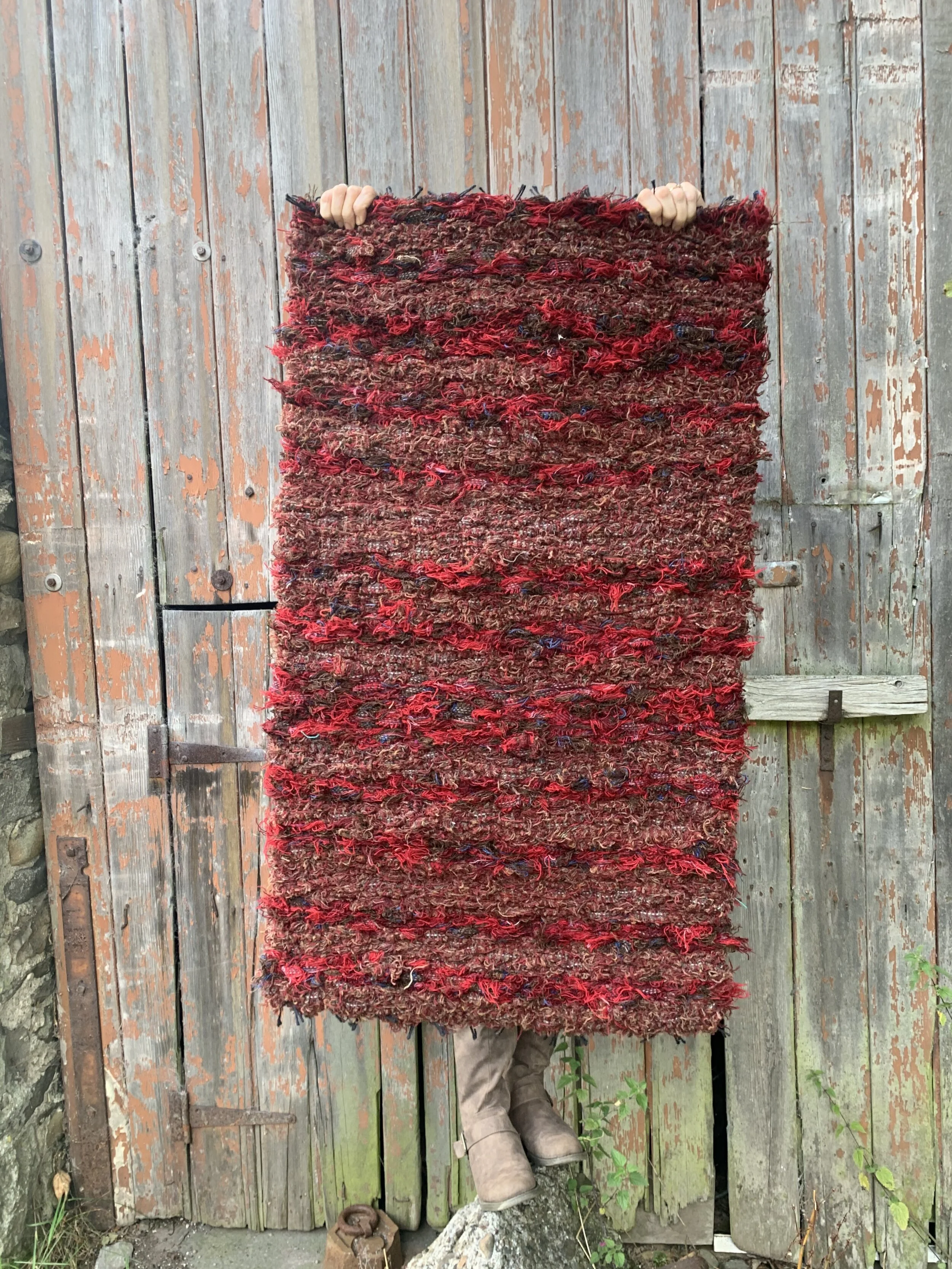 An autumnal coloured handwoven wool rug