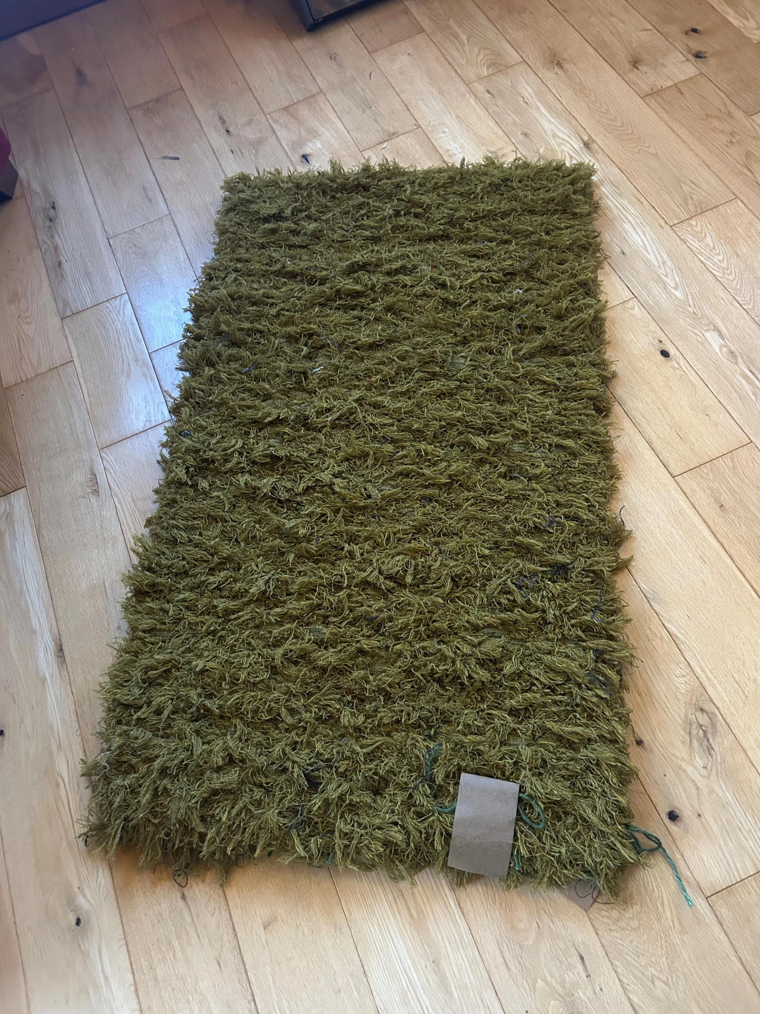 A Gorgeous Green Handwoven Wool Rug