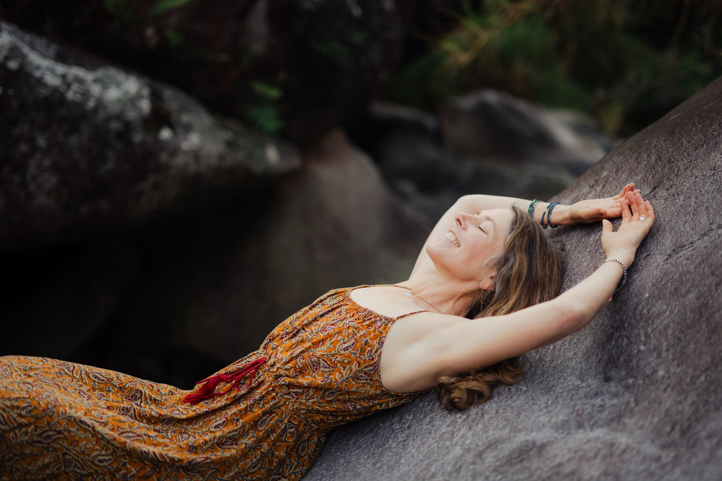 J on rock arms up smile reduced.jpg