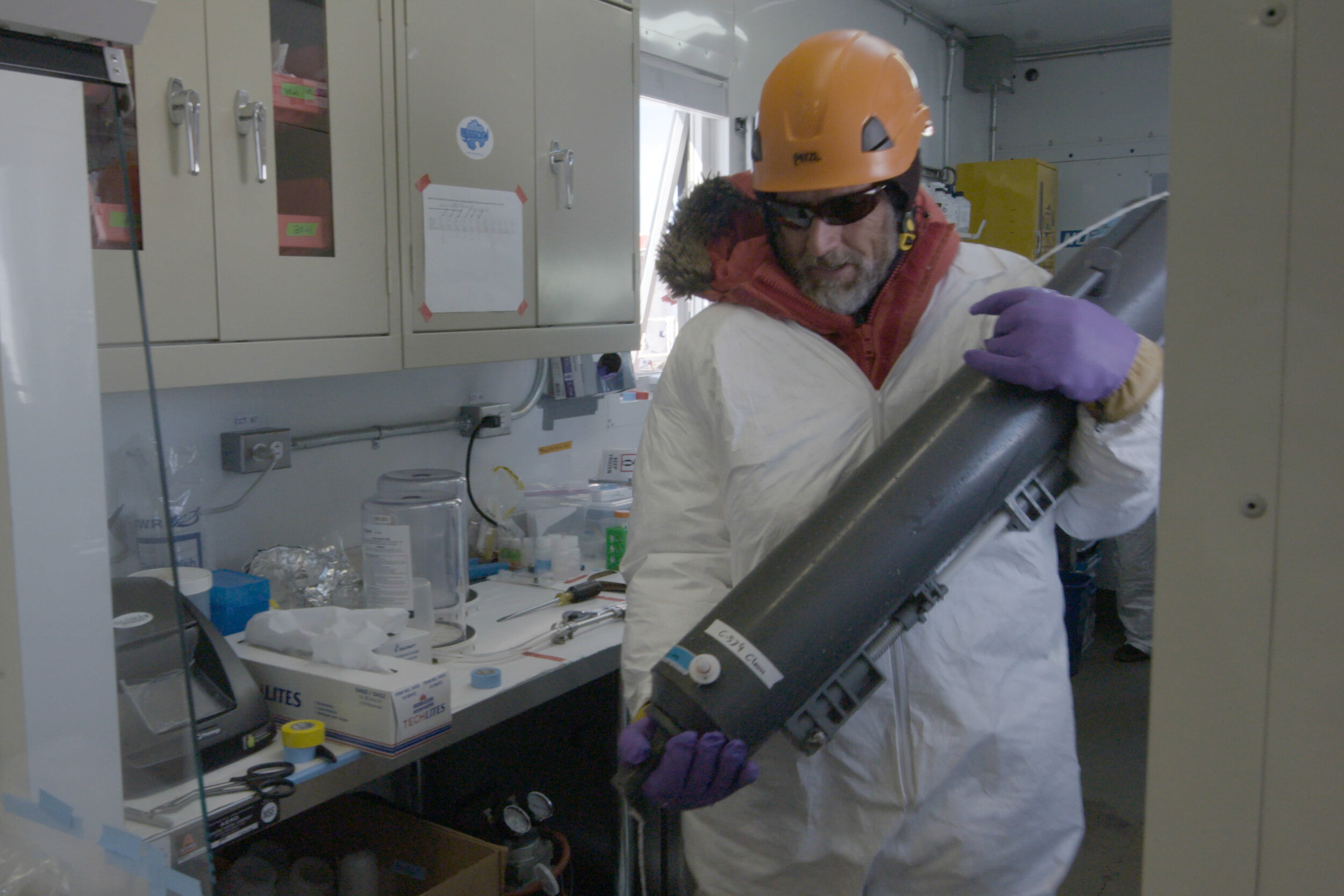 Lead Scientist John Priscu carries a 10 L bottole in the the Chem Lab - Kathy Kasic - 905_2764.MXF.16_45_56_05.Still002.jpg