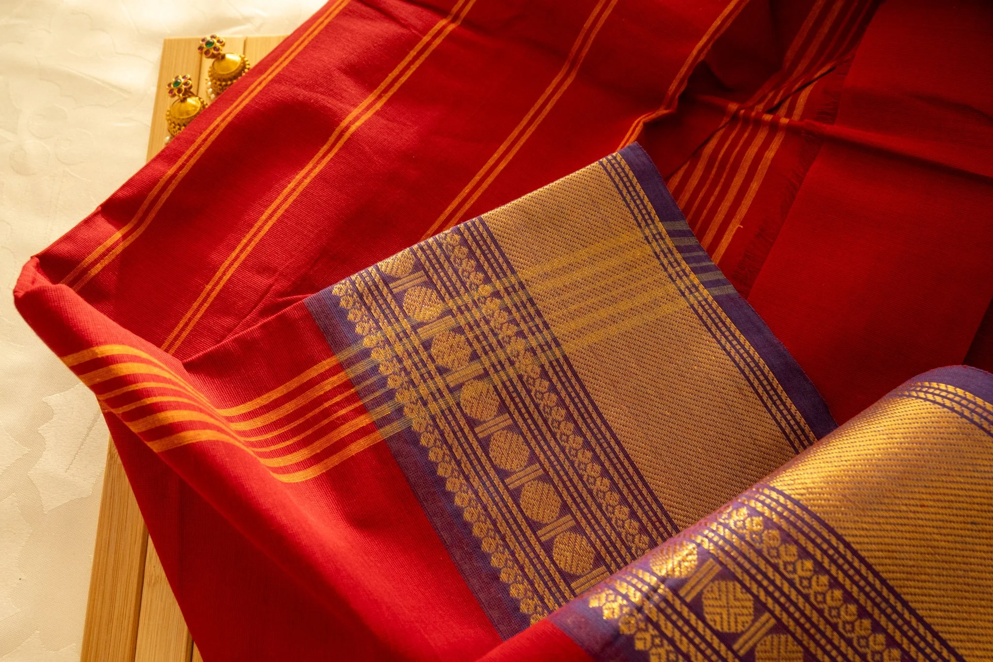Mexican red with purple border - Nadhi | The Saree Store