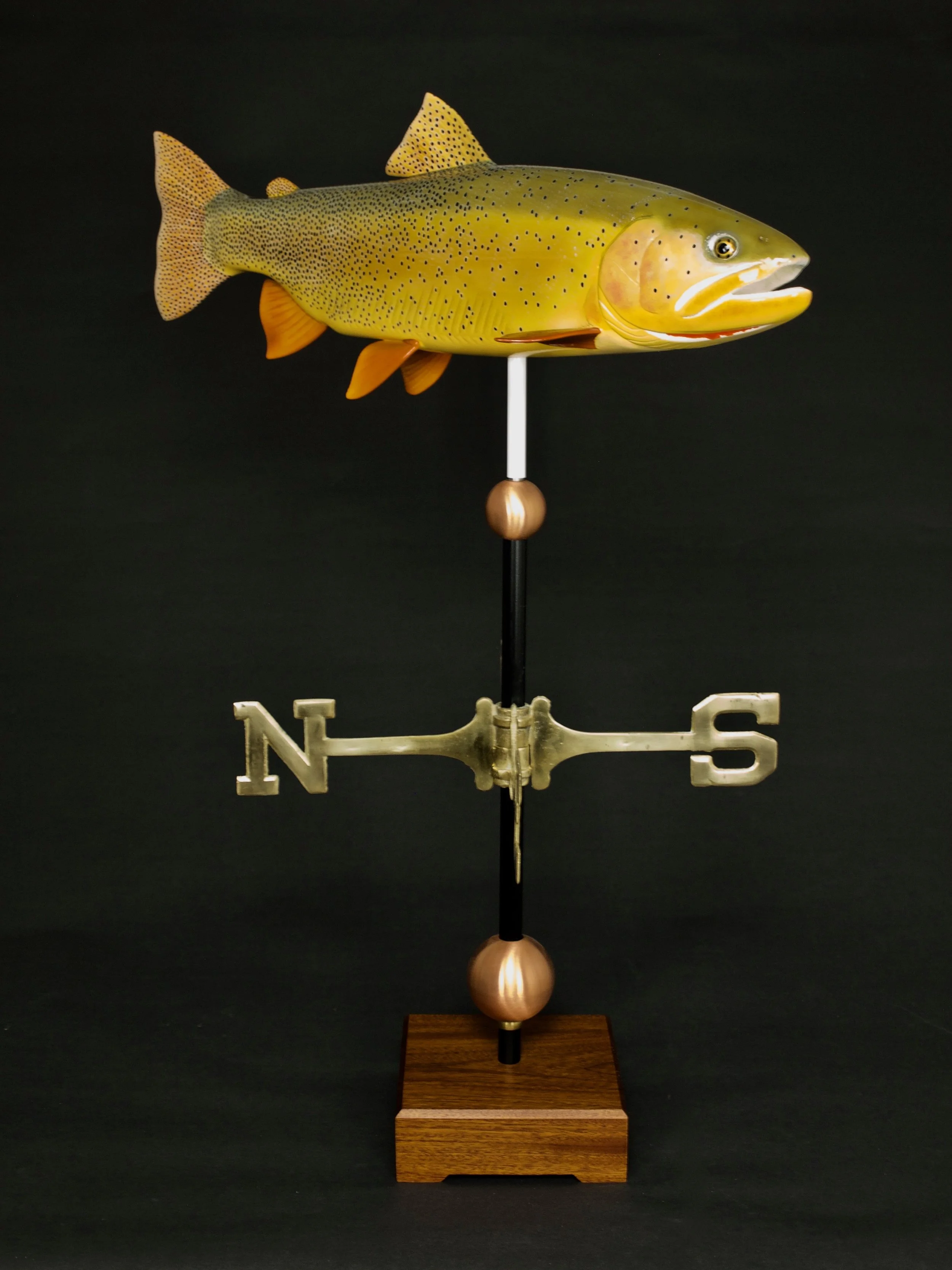 While created to withstand the exterior elements, commissioned for an interior display with Orange Osage base. Fine Spotted Cutthroat Trout. 27" Wood-marine epoxy composite weathervane (northern white cedar), scale 1.69:1. Modeled on specimens caught