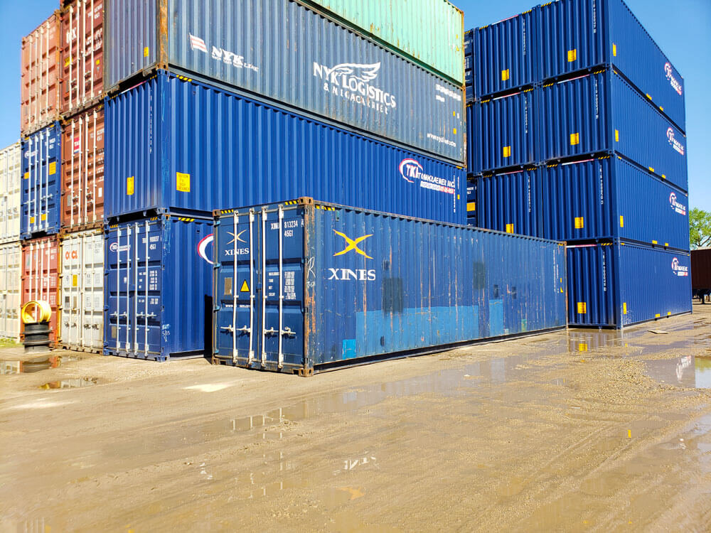 Used blue 40' containers stacked