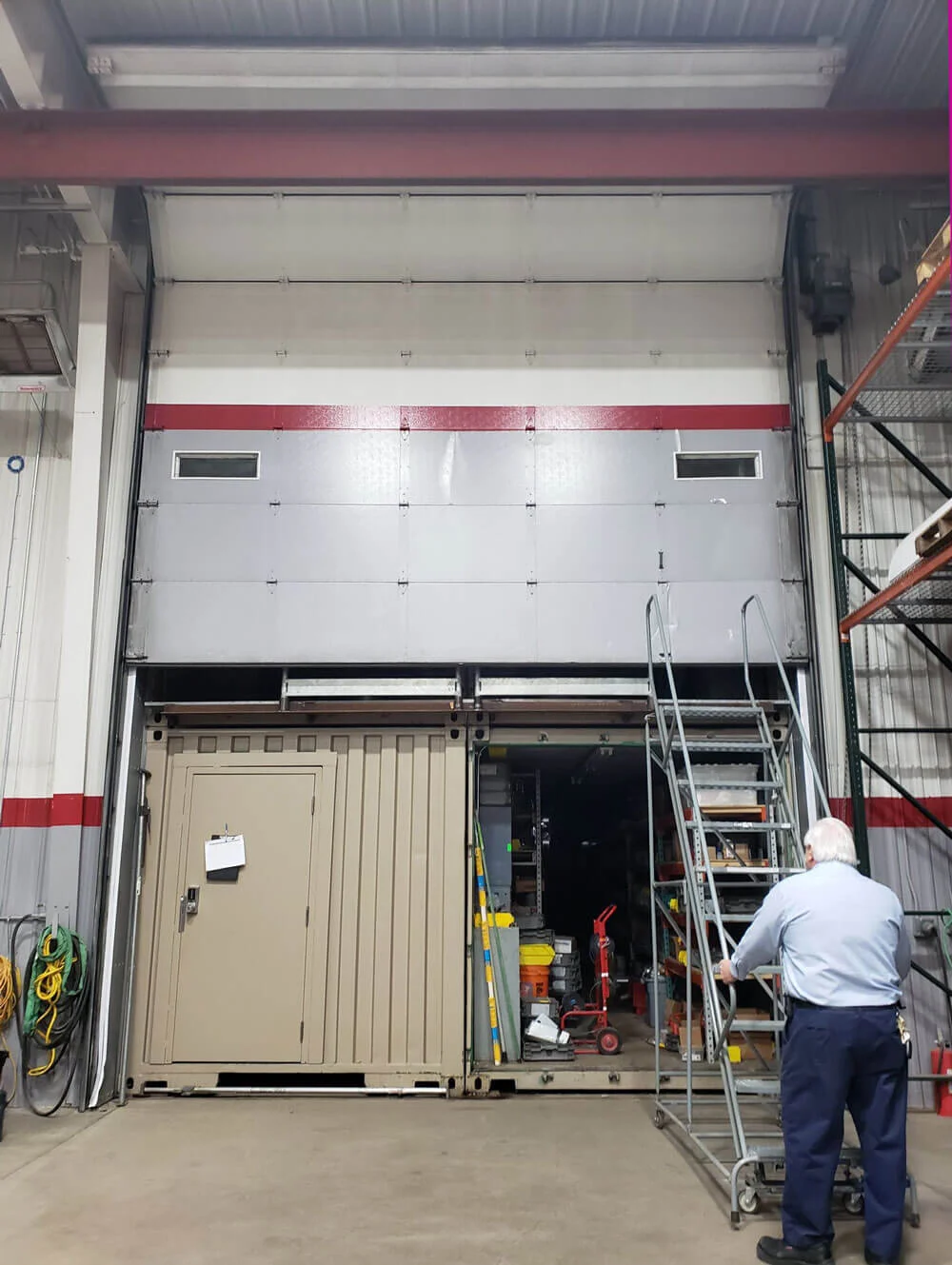 A 16’ overhead door opens to reveal 4 containers