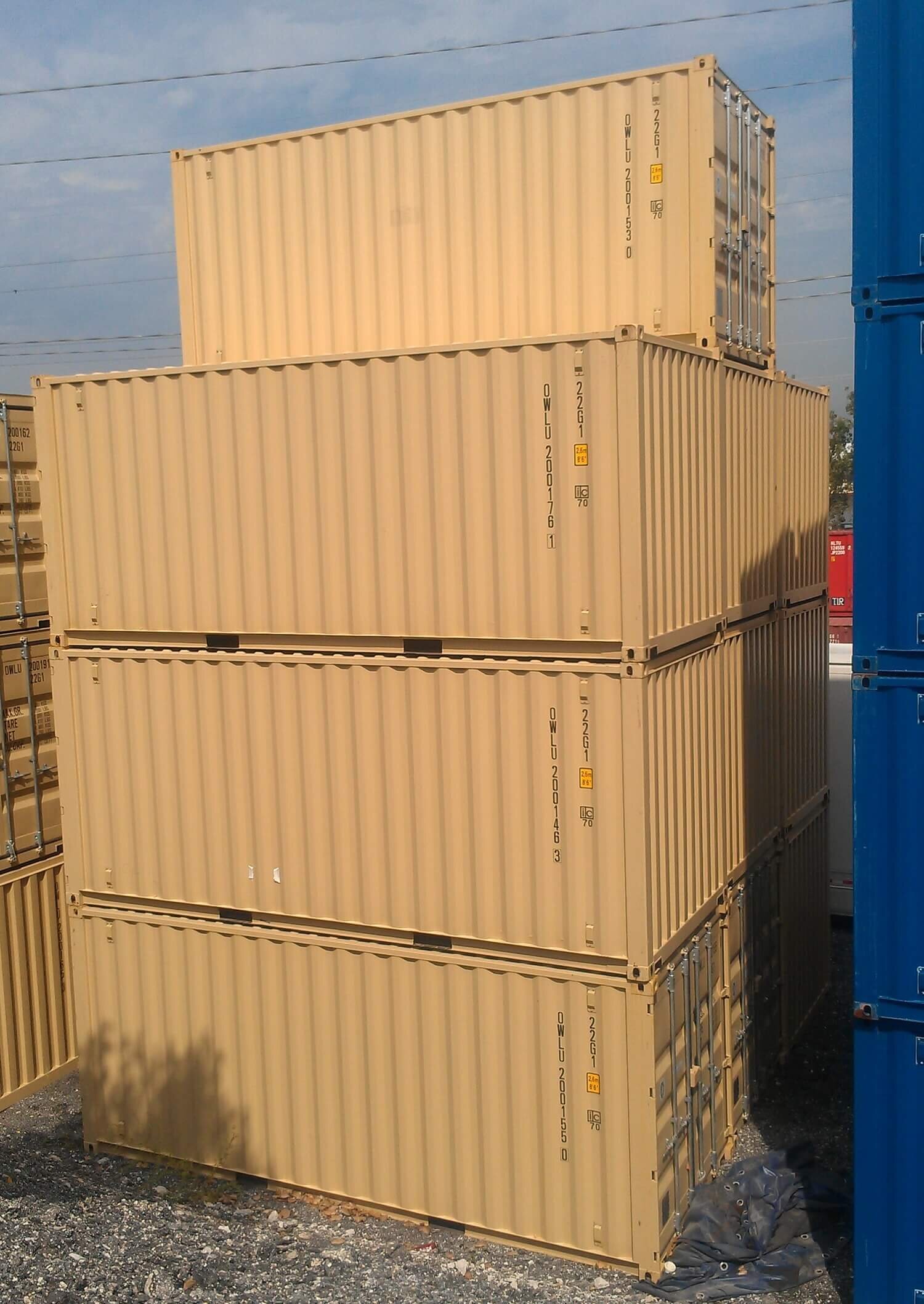 One-trip 20's stacked up. Notice the space between the containers since they are stacked corner post to corner post.