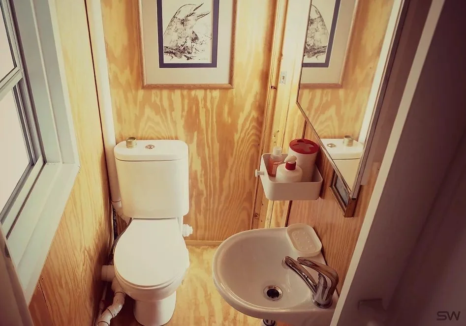 Plywood walls in bathroom of Sterlings container home