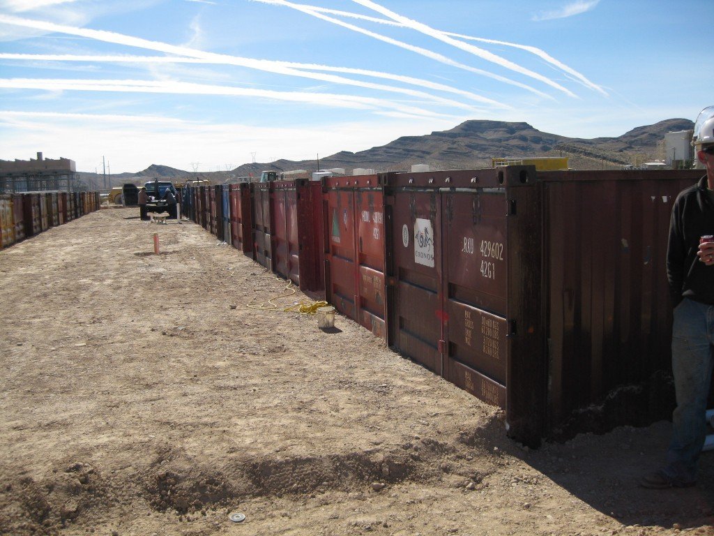 Containers partially buried in the ground