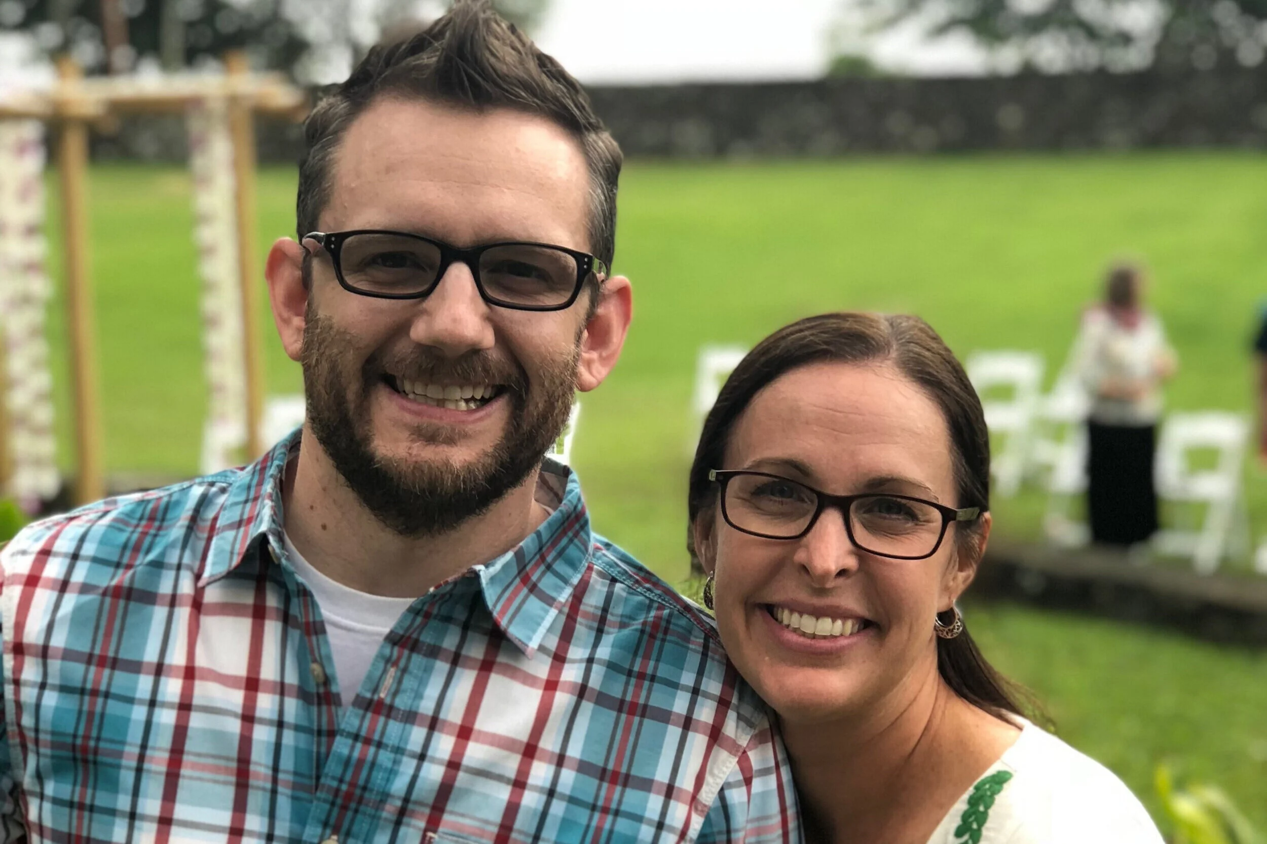 A picture of Thomas Minturn on the left, he wears black rimmed glasses and button up shirt and has a close trimmed brown hair and beard. Doctor Leah Issacson is on the right and has long brown hair, dark rimmed glasses and a white shirt