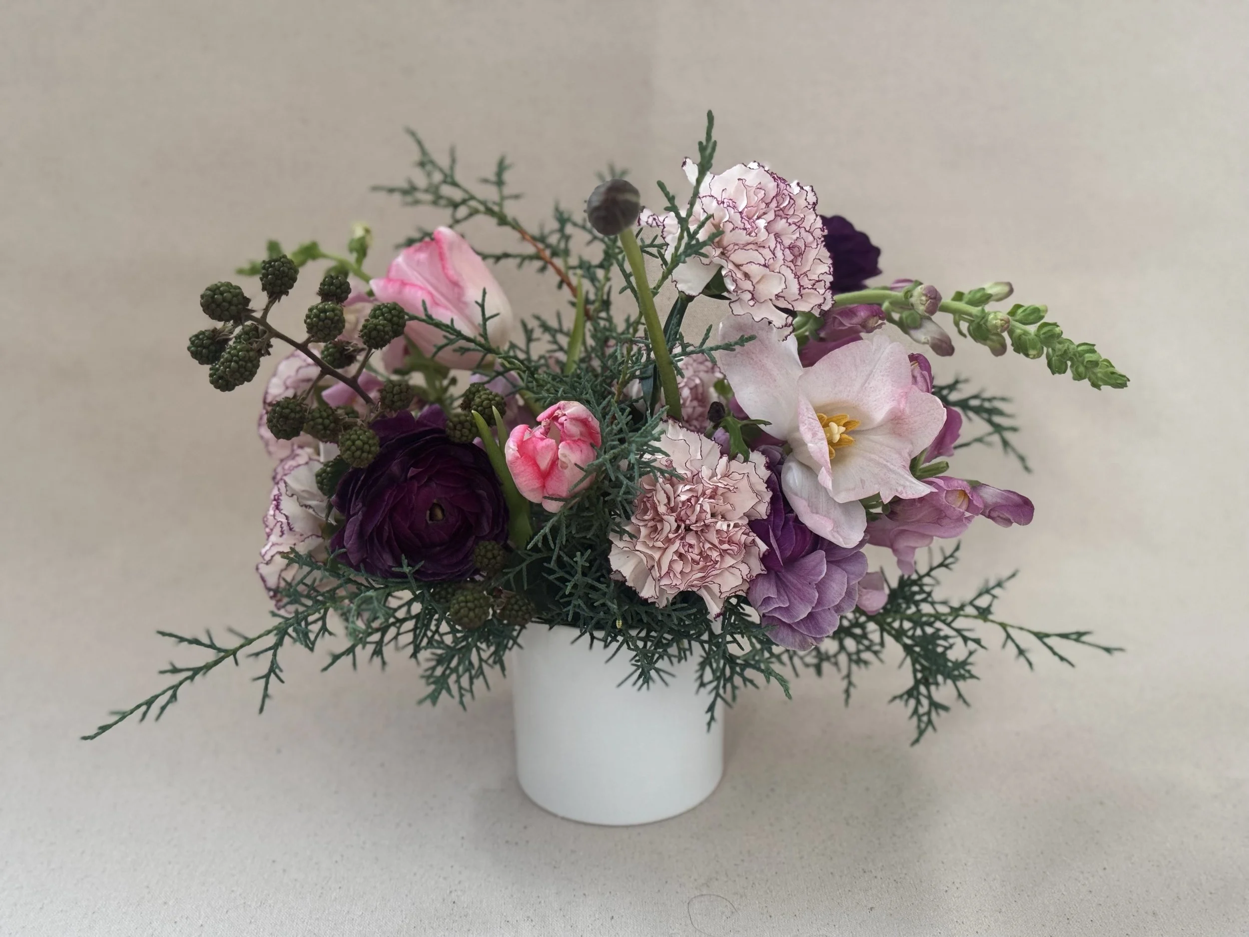 Winter arrangement Tulips Cedar Snapdragons Carnation Pink and Purple.jpg