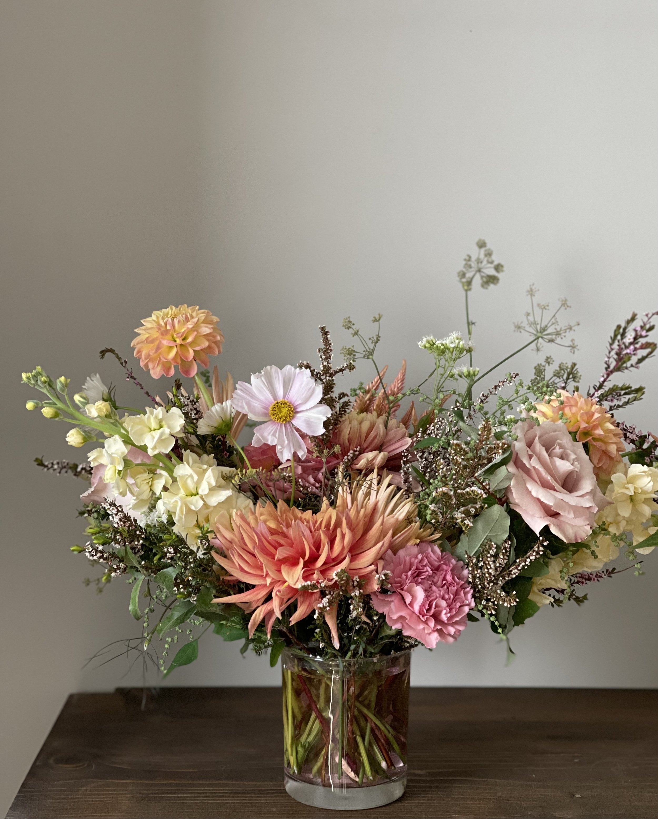 Fresh floral arrangement with roses stock dahlias cosmos.jpg