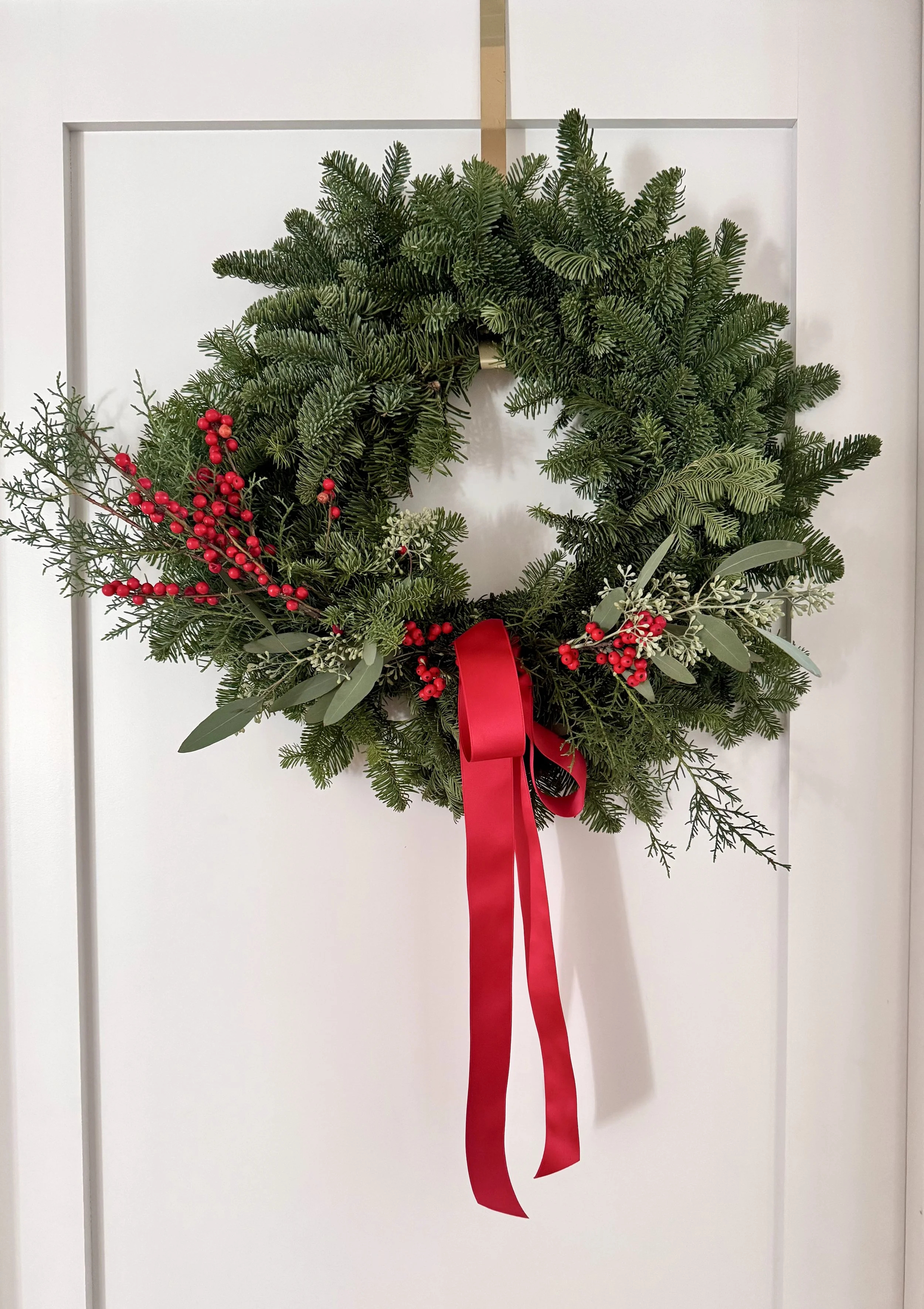 Holiday Wreath with Winter Berries and Red Ribbon.jpg