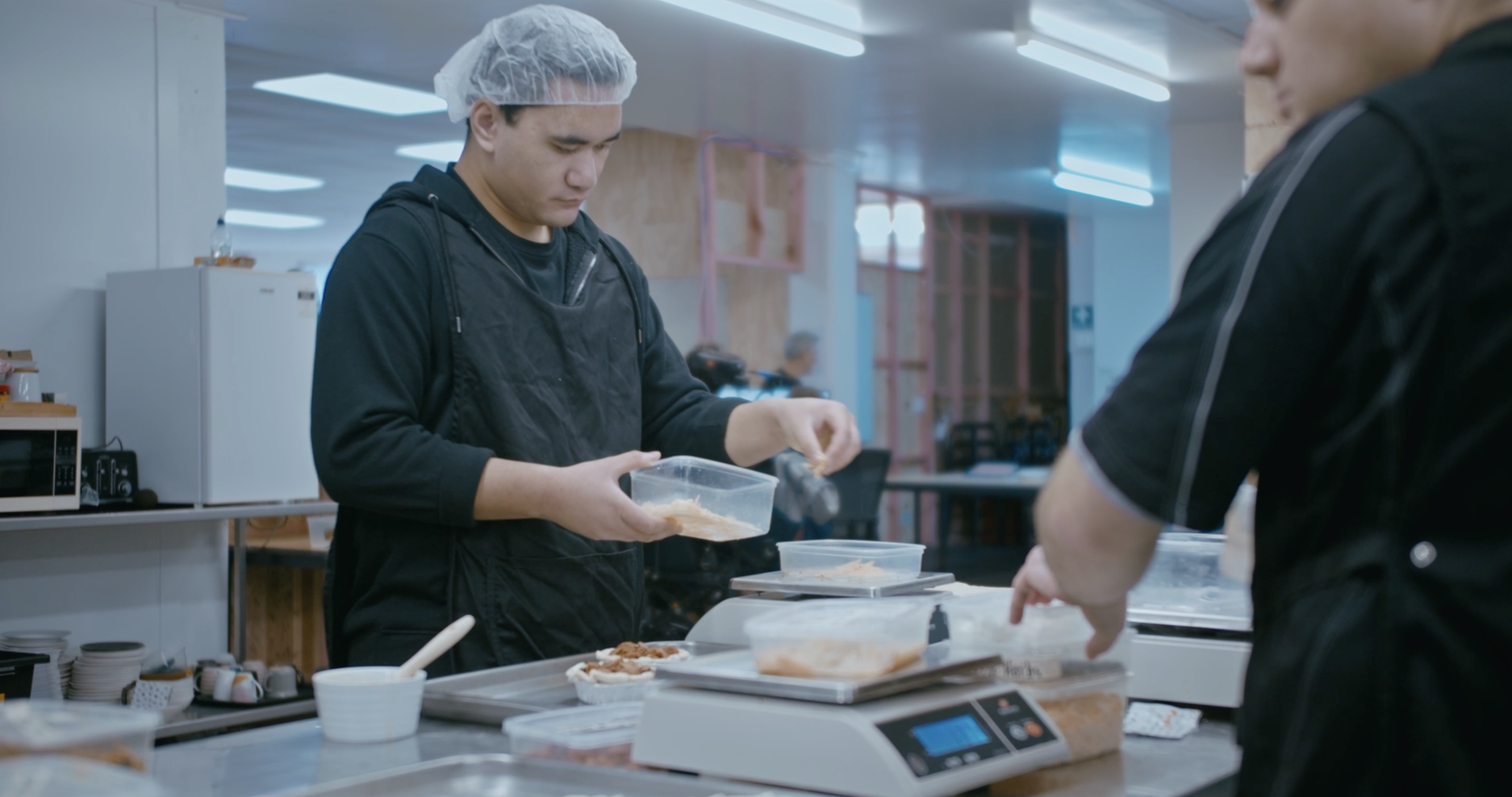 Trainee making pies in the kitchen.