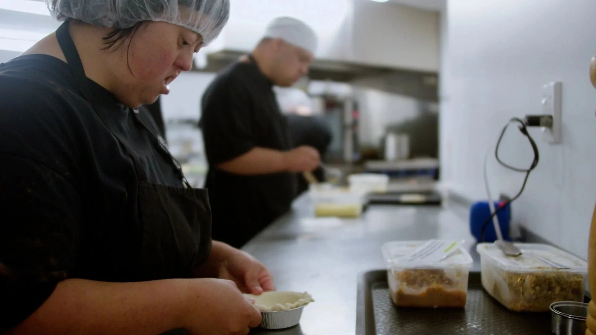 Taimahi trainee making a pie.
