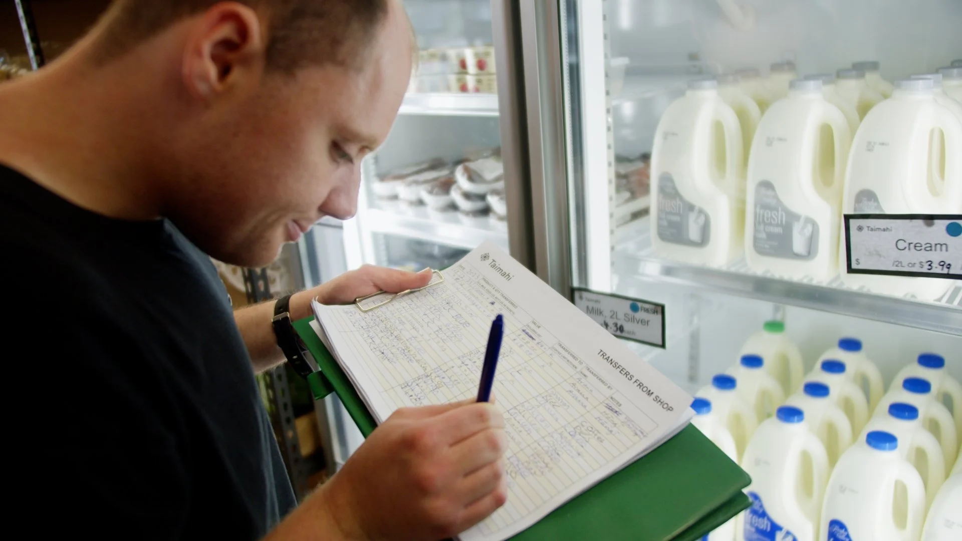 Taimahi trainee checks stock levels by the fridge
