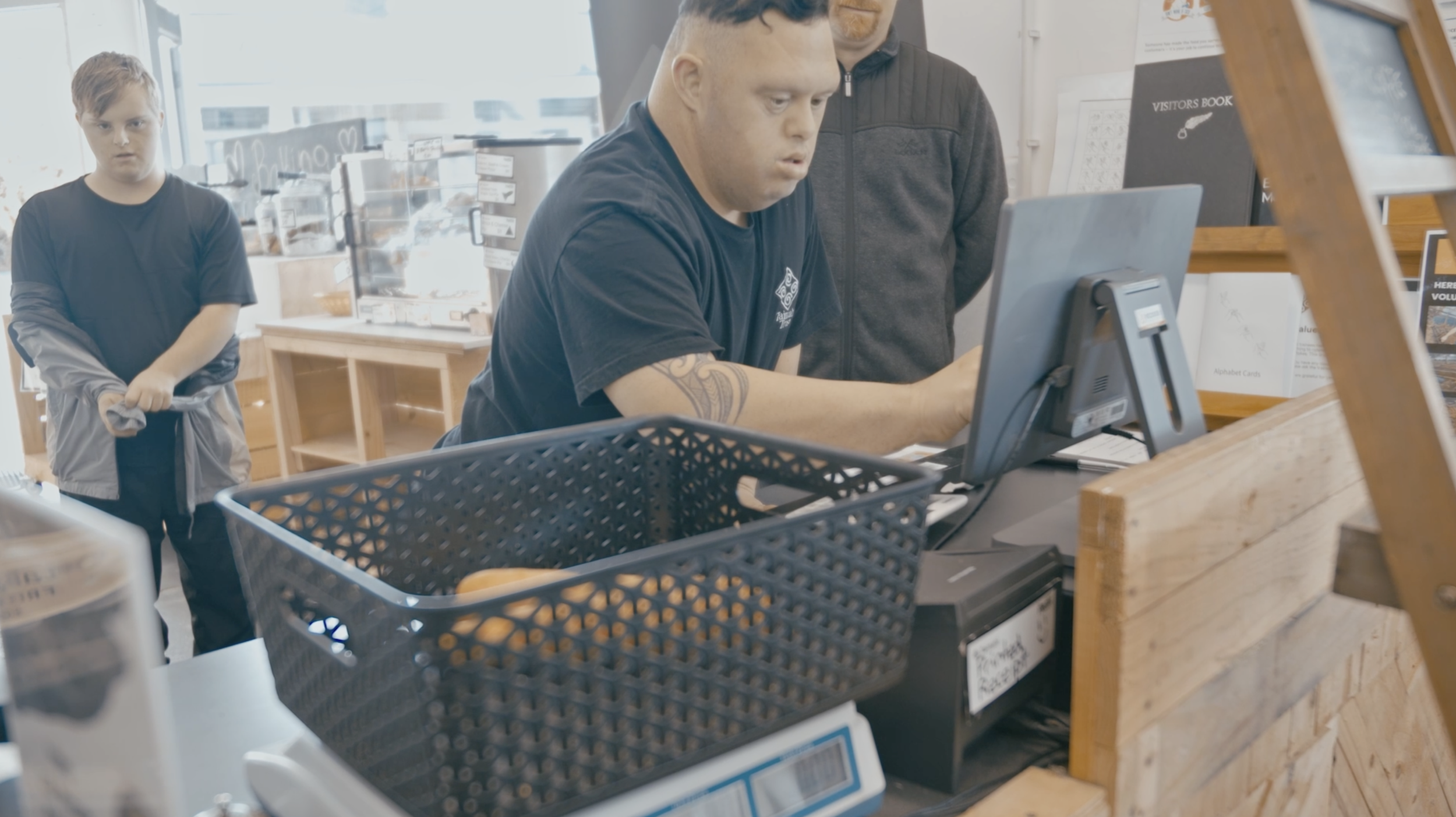 Trainee working the till.