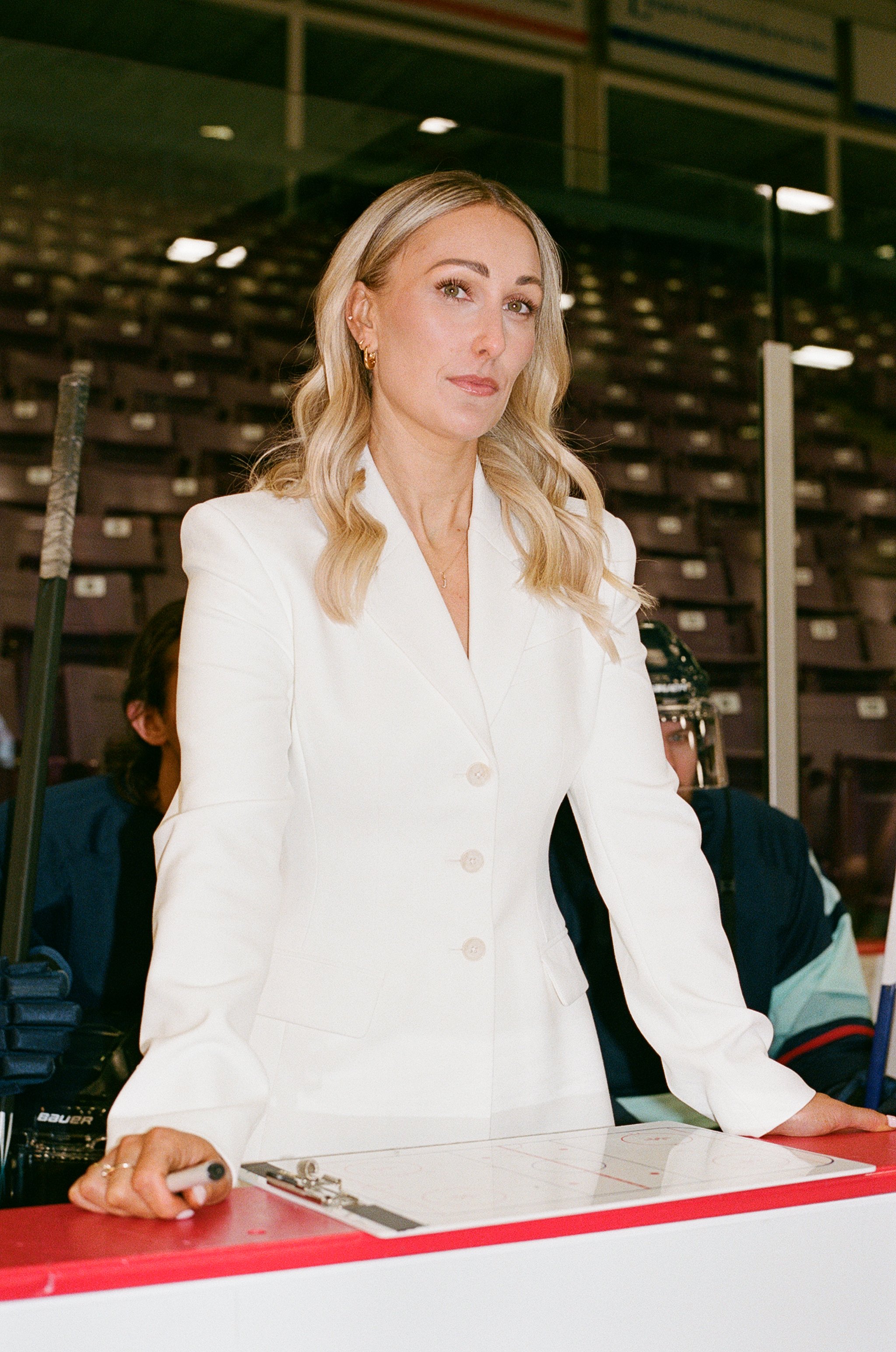 Jessica Campbell posing in front of empty stadium seats