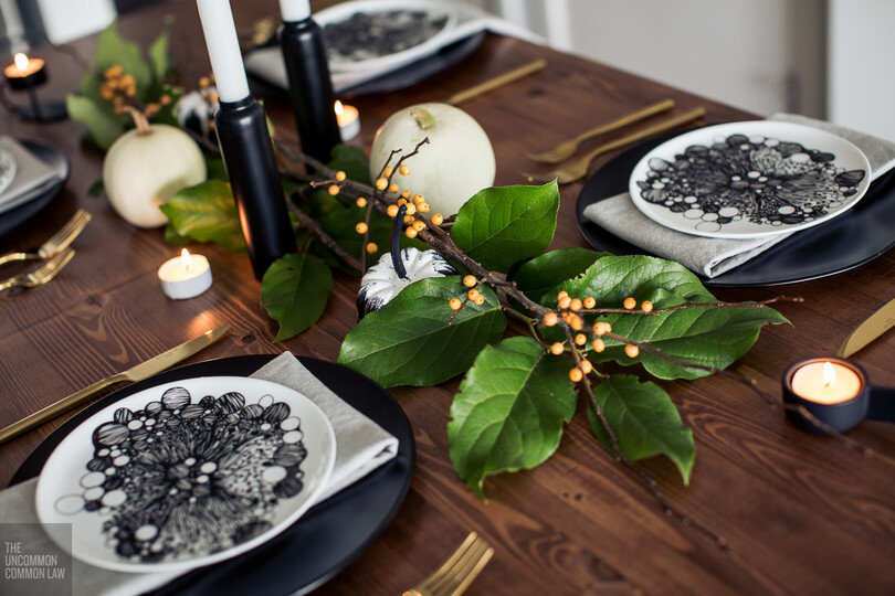   Black plates:&nbsp;   Ikea   , pattern plates:&nbsp;   CB2   , napkins:&nbsp;   EQ3   , gold cutlery:&nbsp;   CB2   , black taper candle sticks:&nbsp;   CB2   , black tea light holders:&nbsp;   EQ3   , greenery and berries:&nbsp;   The Flower Facto