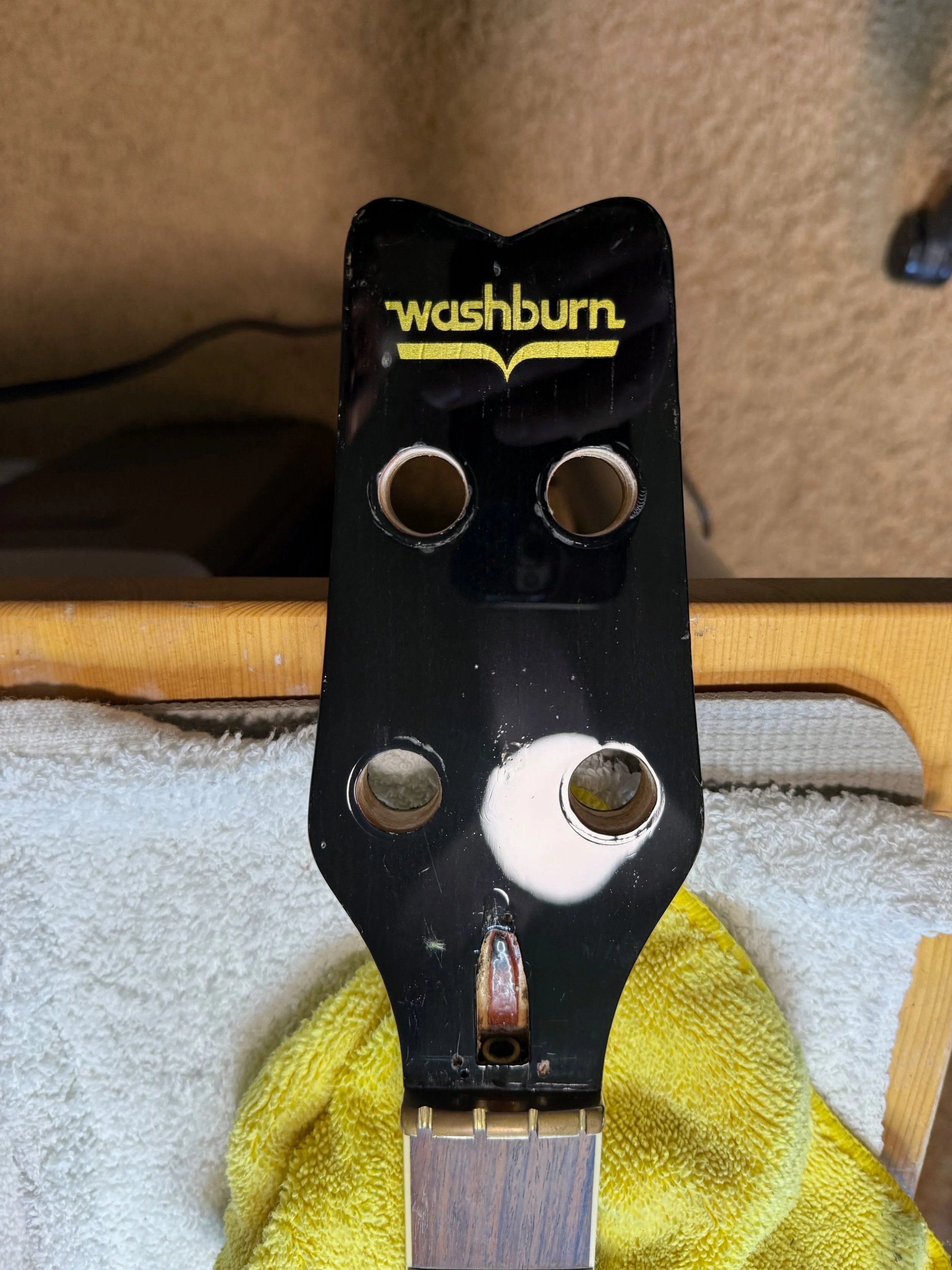 Headstock polished after filling in holes from the wrong truss rod cover