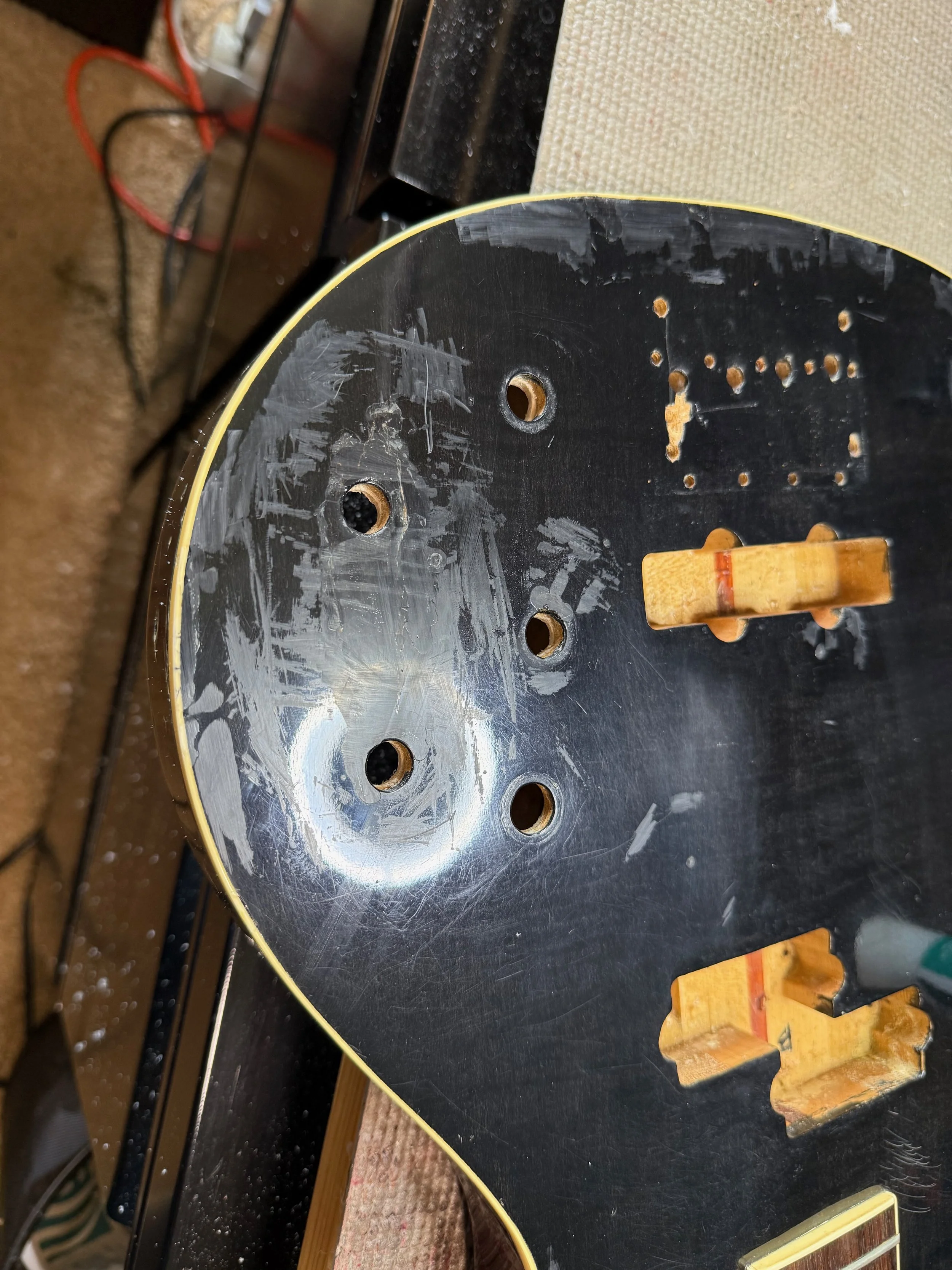 GluBoost is applied and the top scraped off by a razor blade before wet sanding