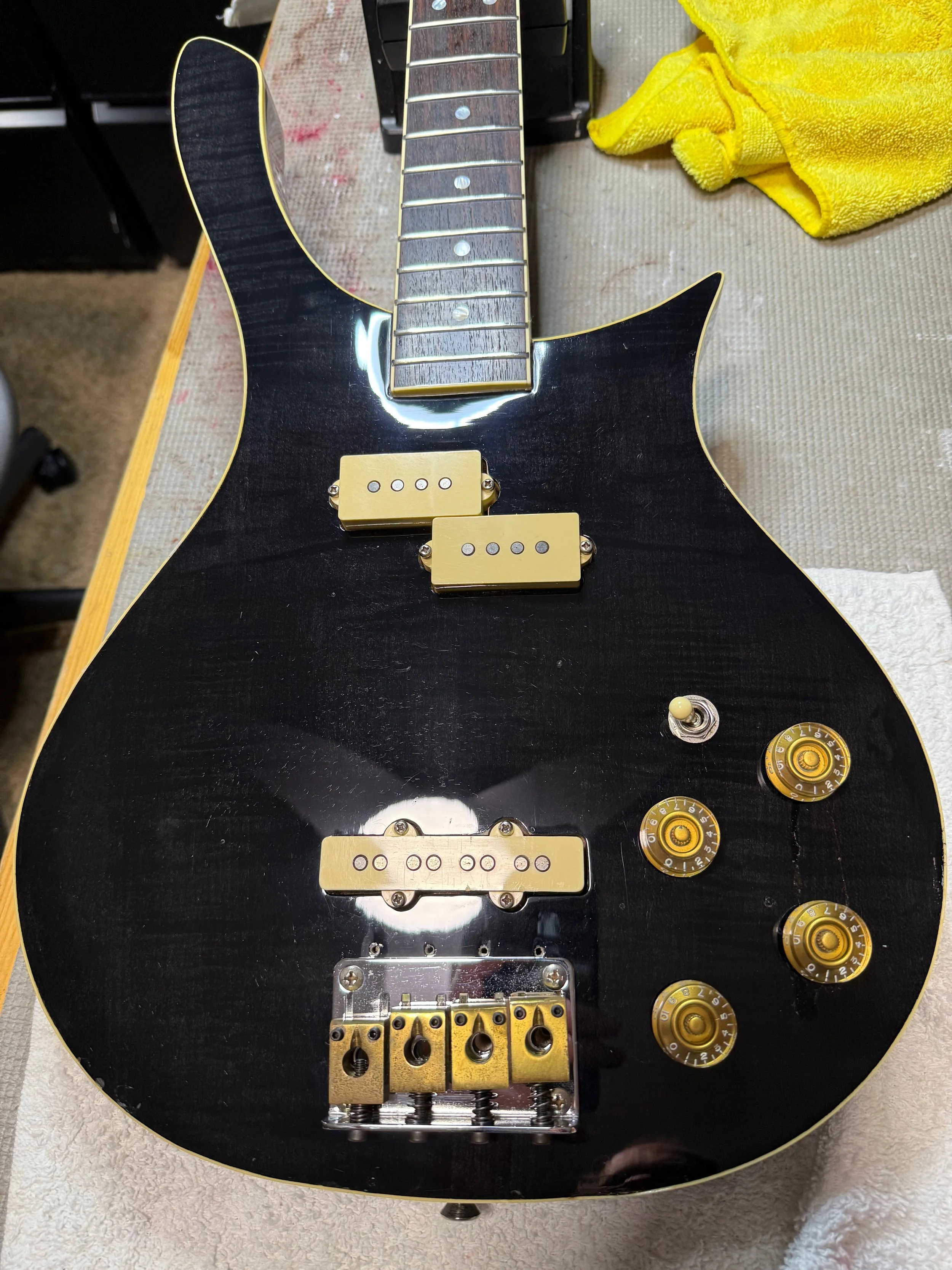Pickups, bridge, knobs, and electronics back in