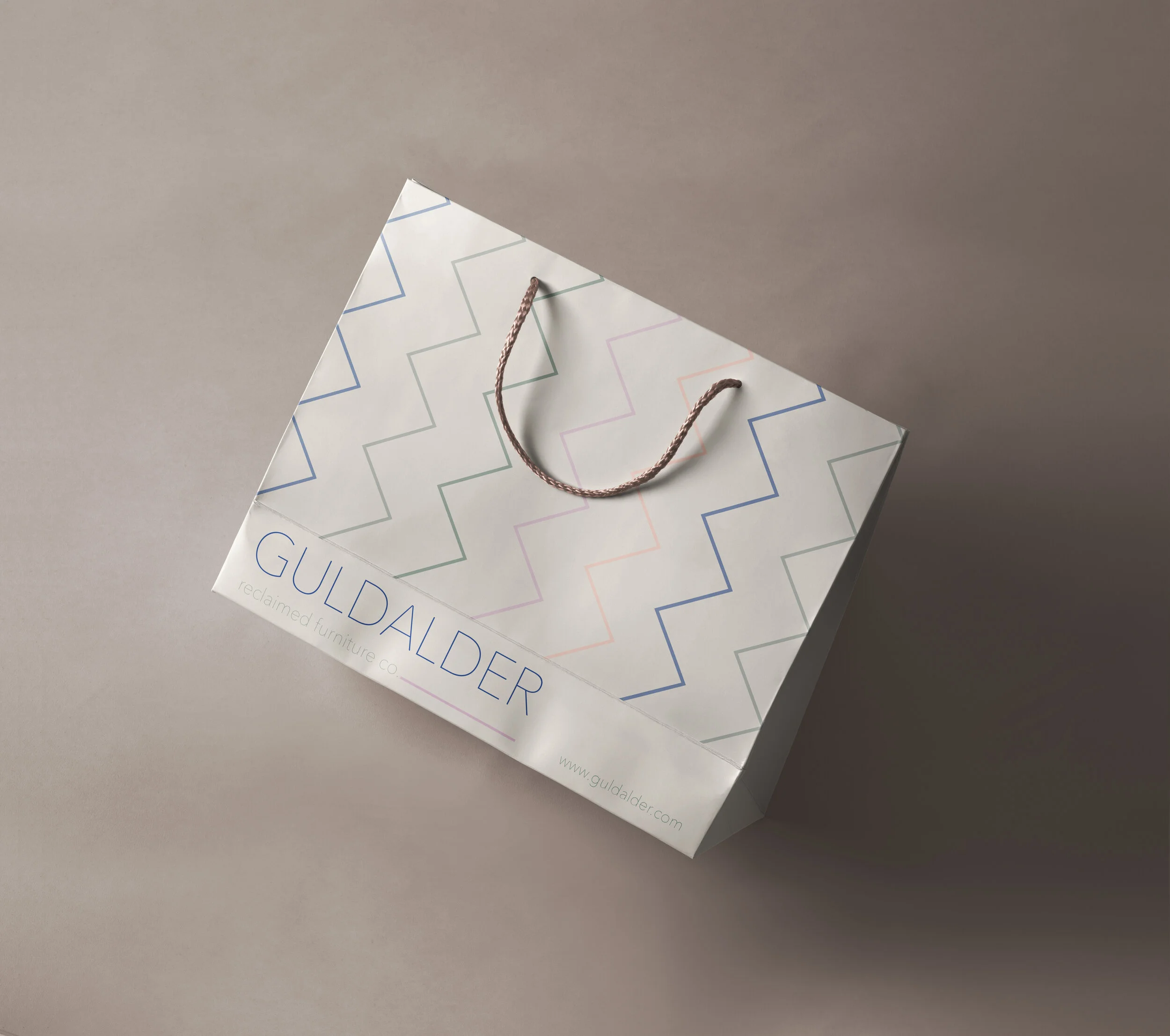 Guldalder branded shopping bag.