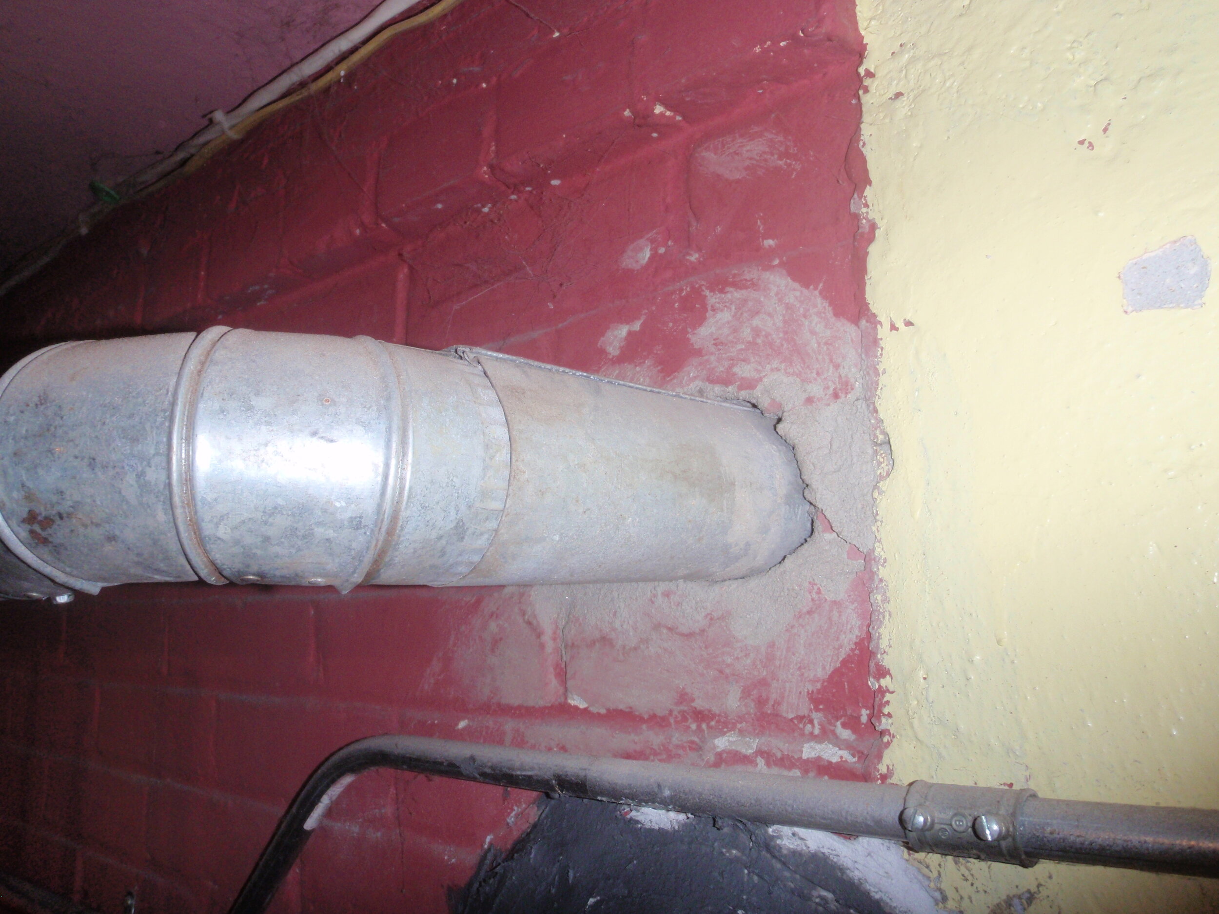 Flue Pipe Improperly Connected to the Chimney without the Required Thimble