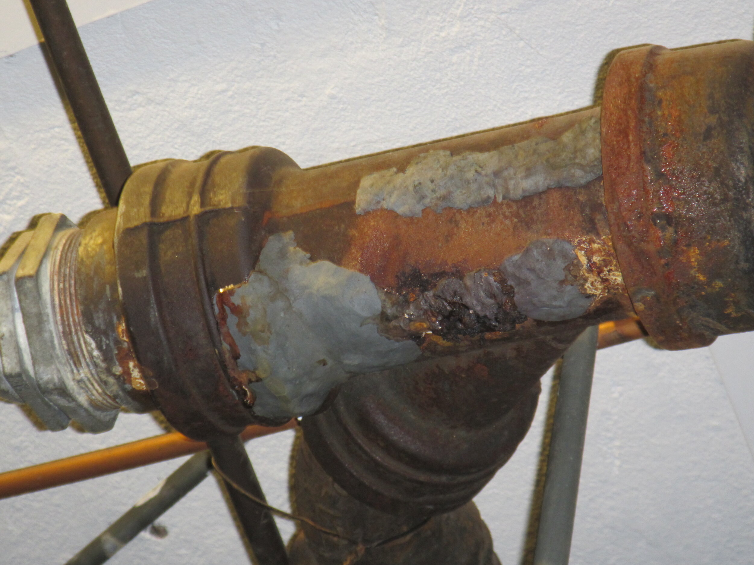 Corroded Cast Iron Waste Plumbing