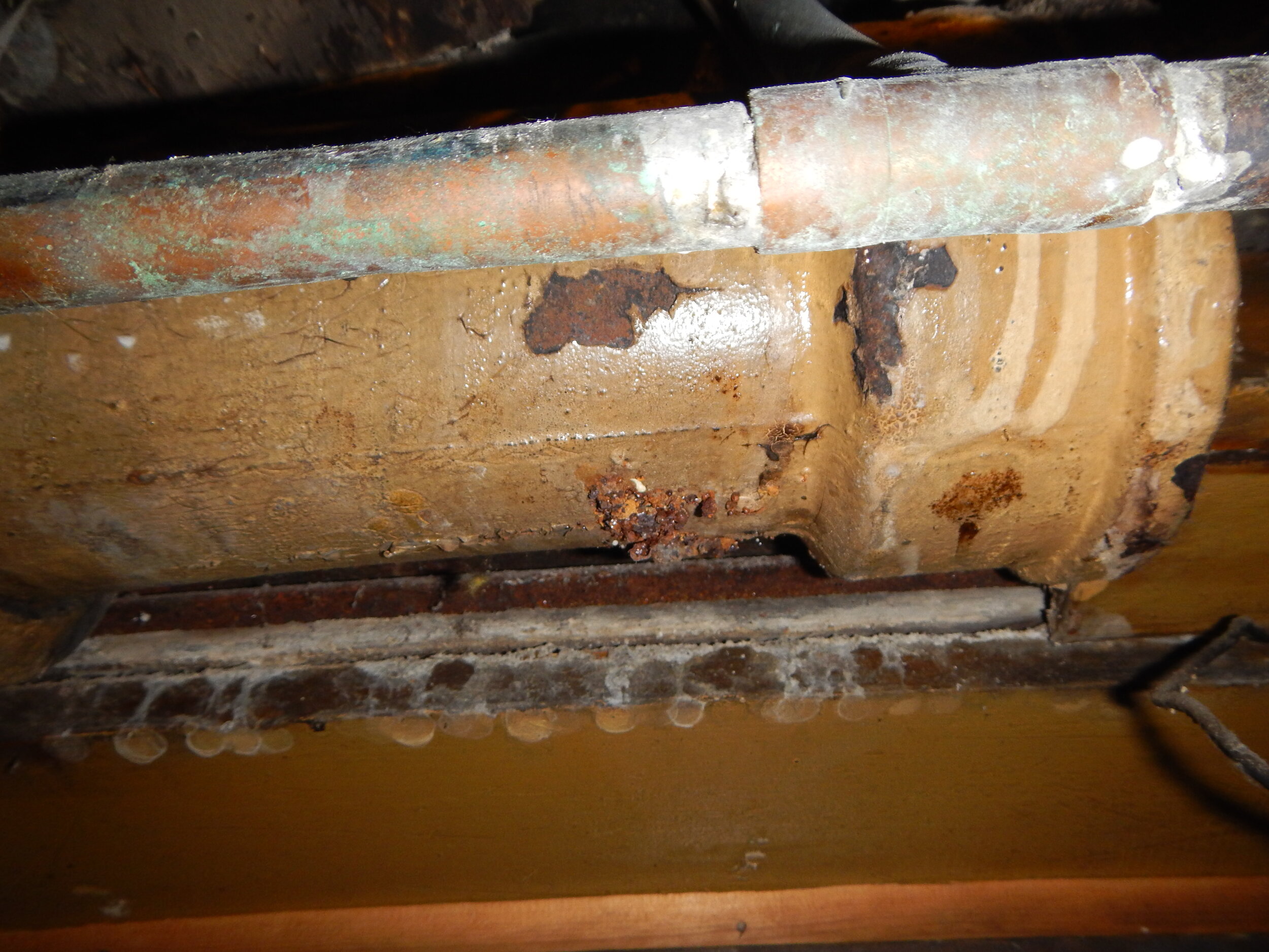 Corroded and Leaking Cast Iron Waste Plumbing