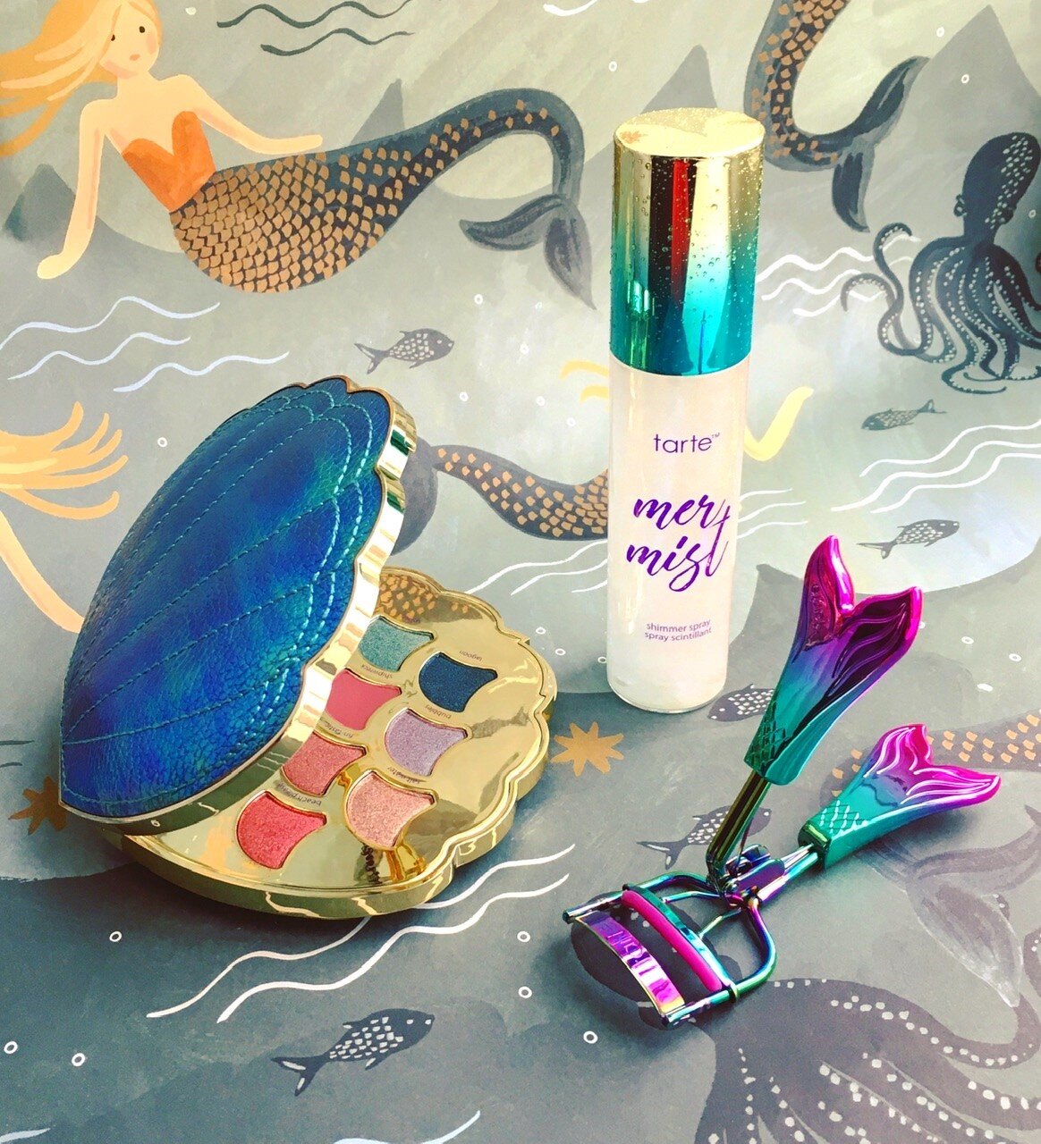   Be a Mermaid and Make Waves Eyeshadow Palette, Facial Mist and Eyelash Curler   Tarte Spring 2018   Eager to jump on the mermaid bandwagon, in early 2018 Tarte released a rather uninspired mermaid collection consisting of a body mist, face and body