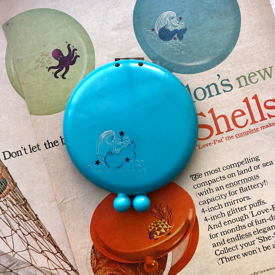   She-Shells Compact Revlon 1965   The ad for Revlon’s “She-Shells” compacts portrays the three items – each with a cartoonish turtle, mermaid or octopus motif on the outer case – as highly collectible. It also represents the beginning of the cosmeti