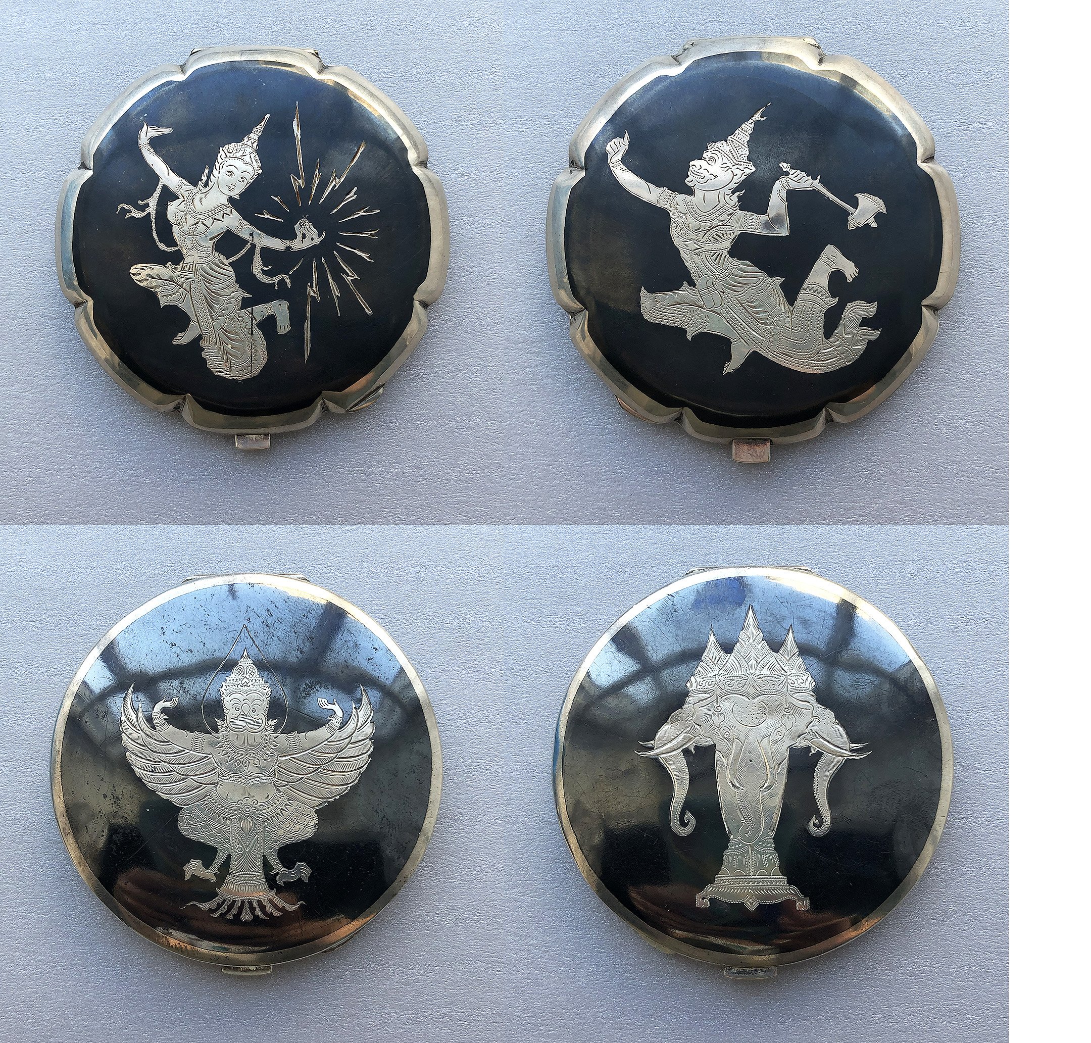   Nielloware Compacts 1940s-1970s   Nielloware is a metalwork craft made by carving a design into a silver background and adding niello, a black-colored metal alloy, to fill in the negative space around the design. Nielloware has been a part of Thail
