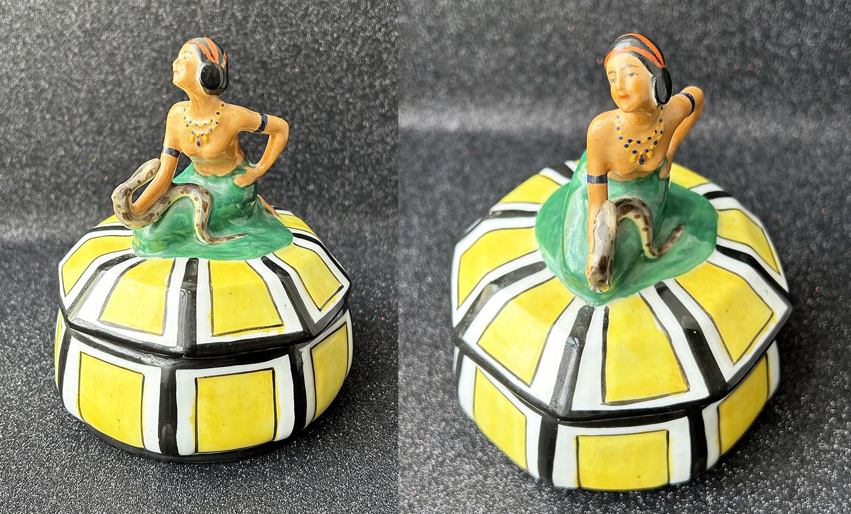   Powder Box  Ca. 1920s   This German-made, porcelain powder box features a seated dark-haired woman holding a snake. The color of her skin is noticeably darker than in other examples of figural powder boxes of the era. The woman’s identity remains a