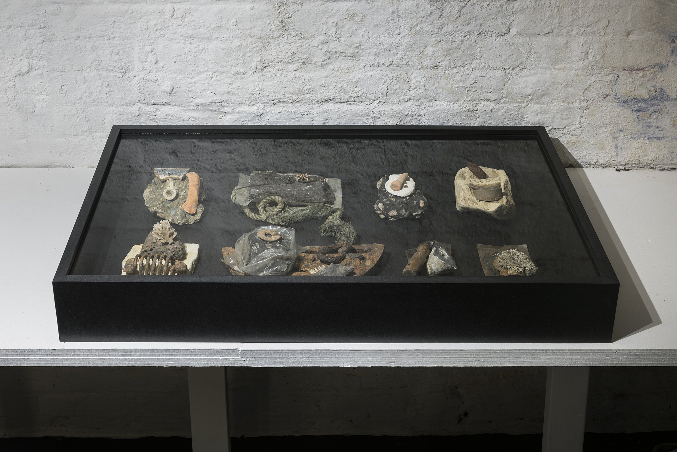   They Say Nothing , Objects/artefacts from London Thames foreshore, MDF and glass, 92x55x12cm 