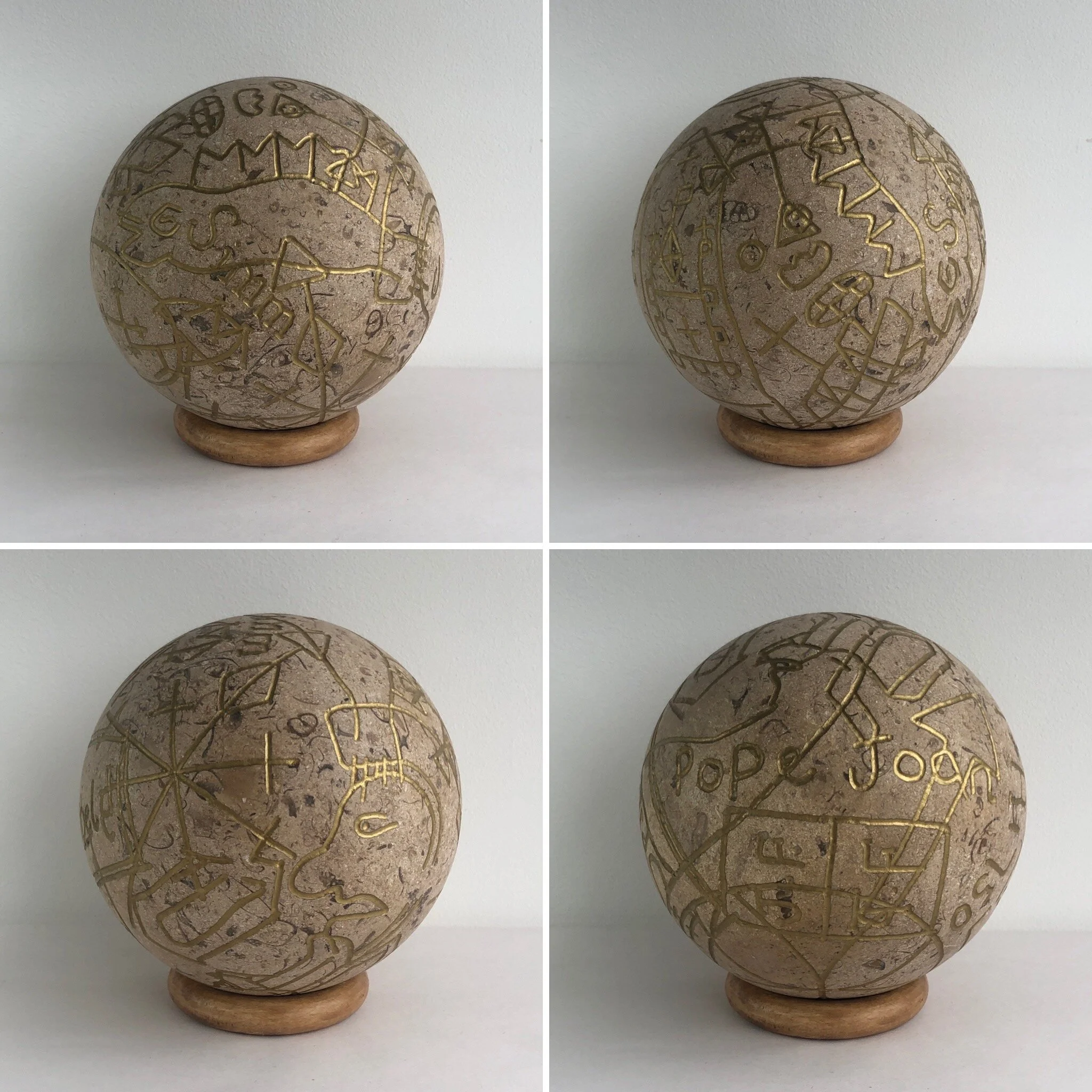   Pope Joan , 2020, fossil stone, ink and wood, 12cm diameter plus stand 