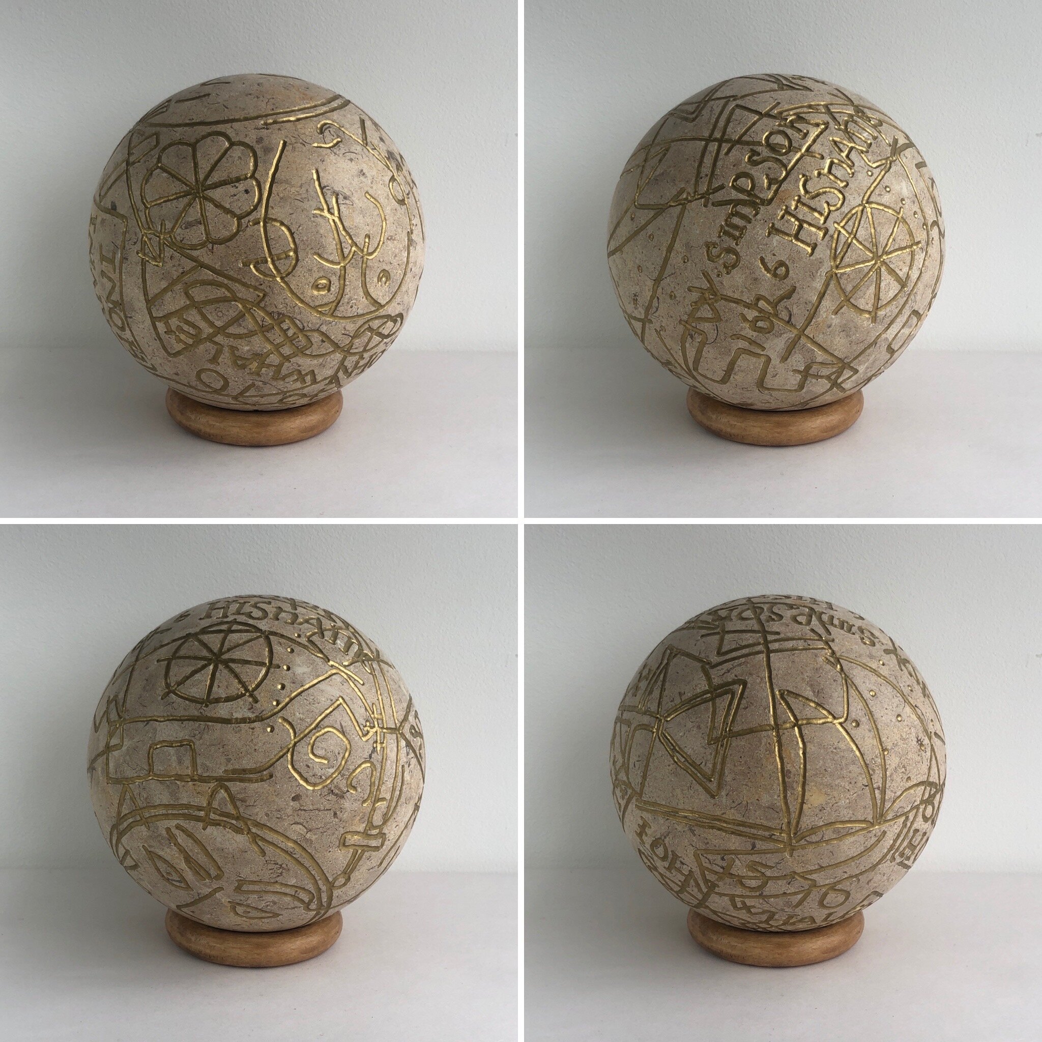   God Help Me , 2020, fossil stone, ink and wood, 12cm diameter plus stand 