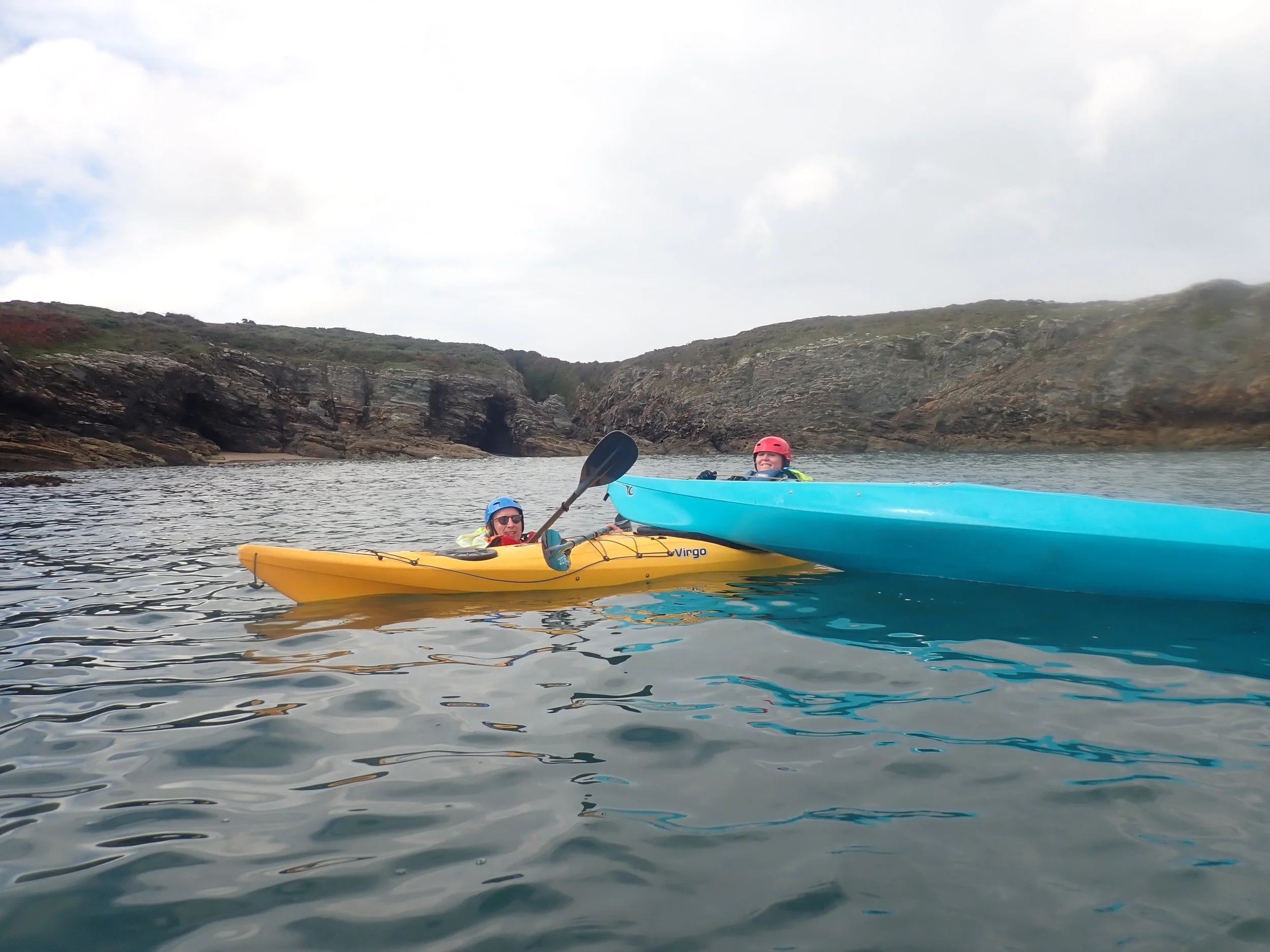 Beginner sea kayaking rescue practice in deep water with coach support (optional capsize drills)