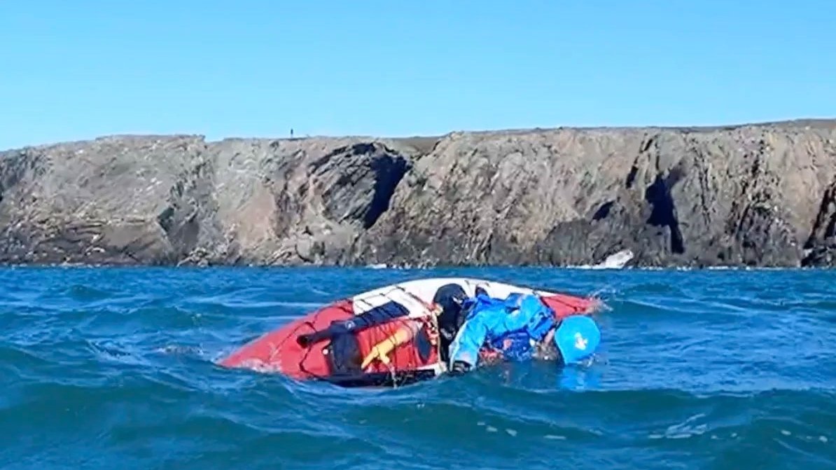 sea kayak rolling in open water