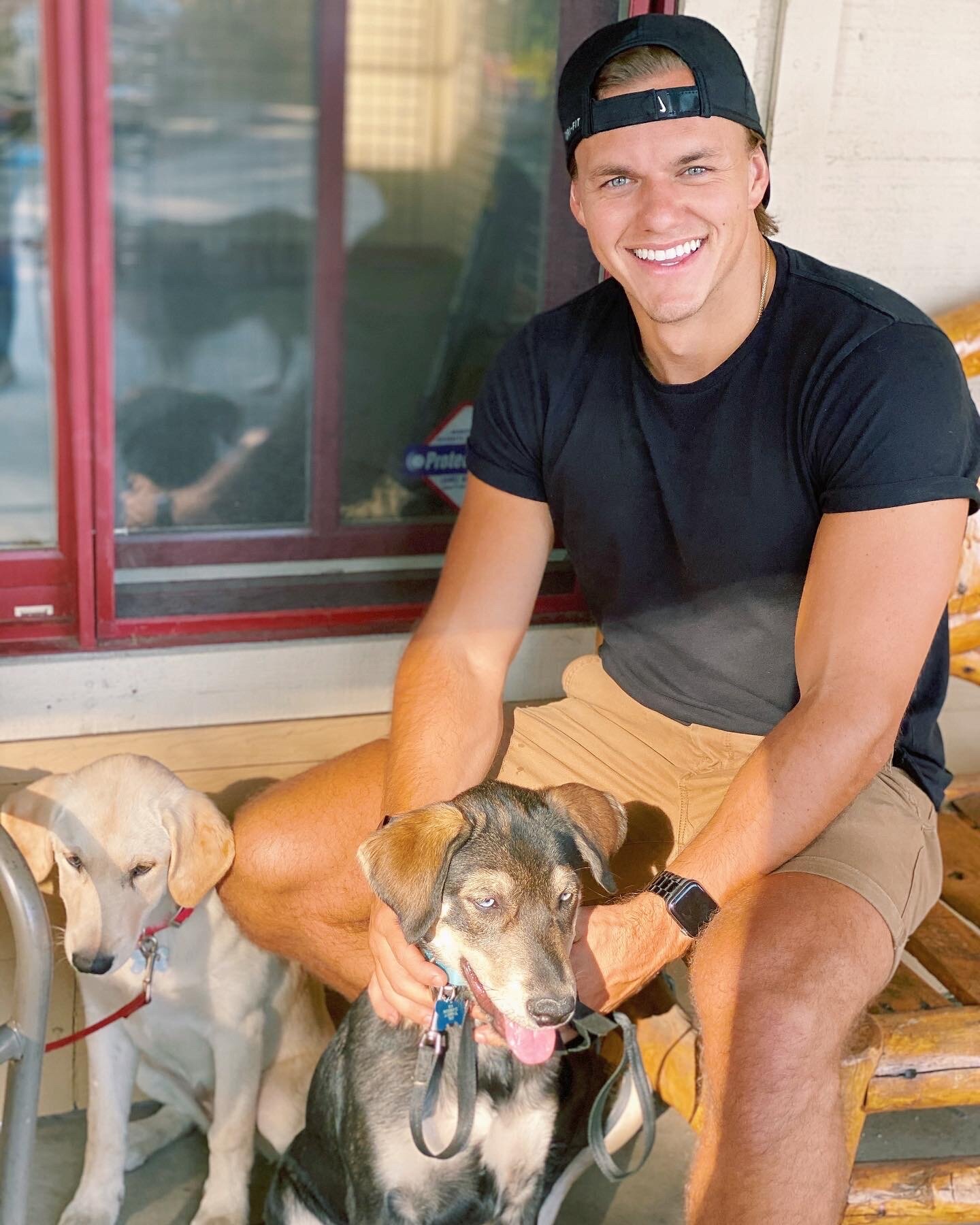 Evan Boydstun with puppies
