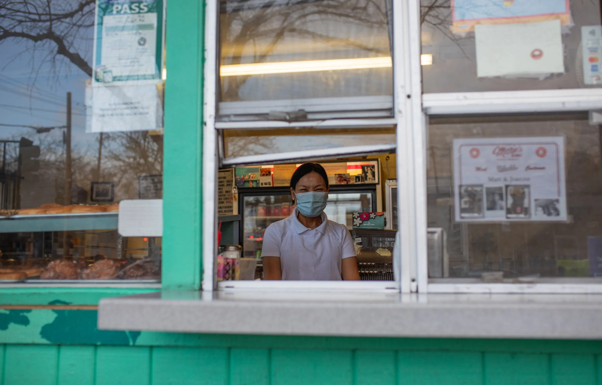 Environmental PortraitAn employee of Marie’s Donuts in Sacramento, Ca pictured working and serving the community during the COVID-19 pandemic. Photo taken by: Sarah Hussey