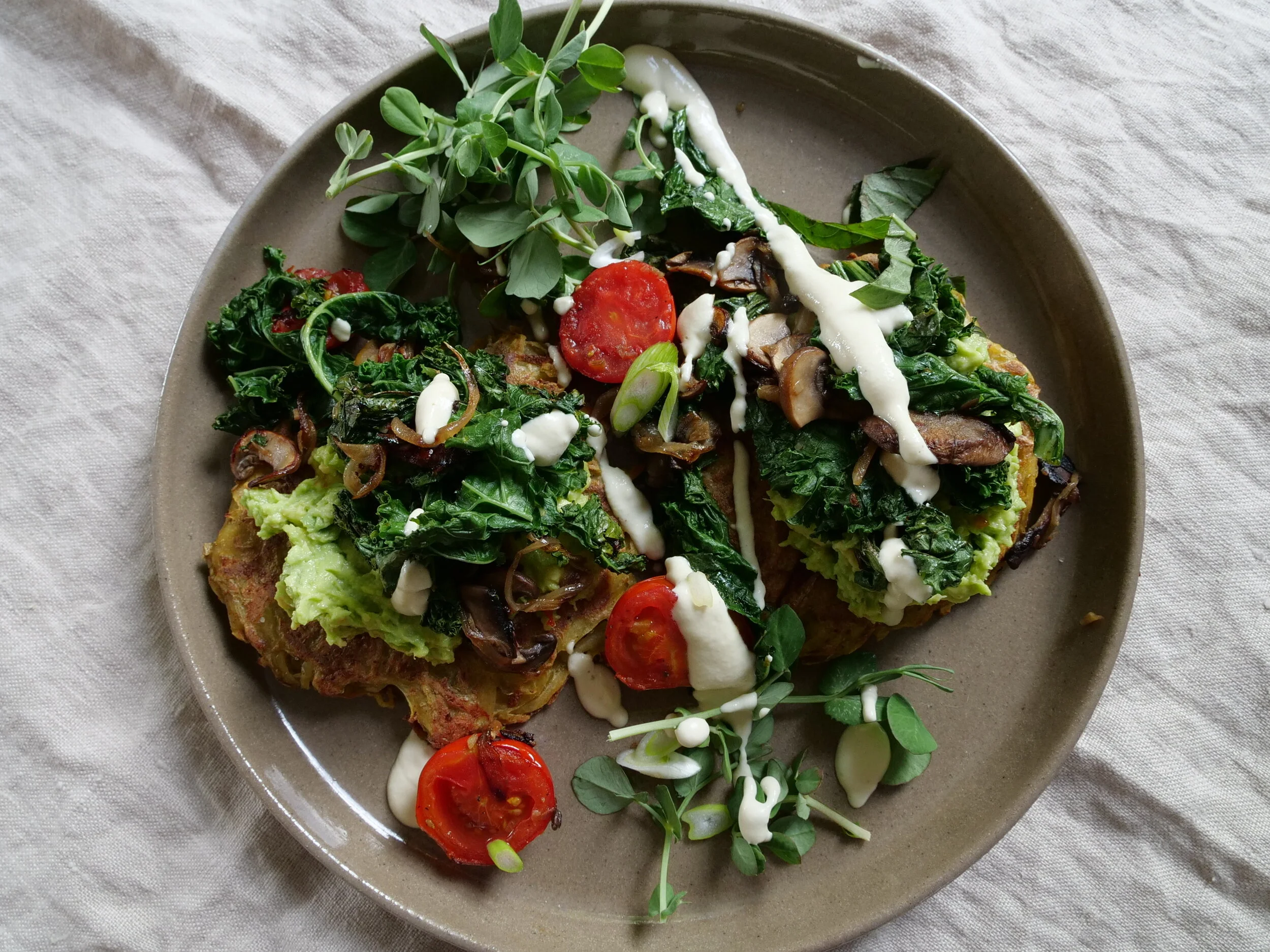 Potato Cakes with Avo Smash, Tomatoes and Greens