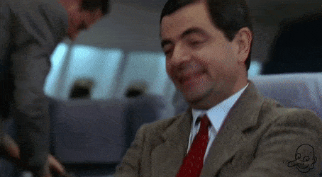 GIF of Mr. Bean enjoying enjoying his First Class seat (credit: giphy.com)