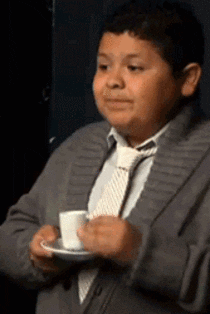 GIF of a boy sipping tea very fancily. (credit: giphy.com)