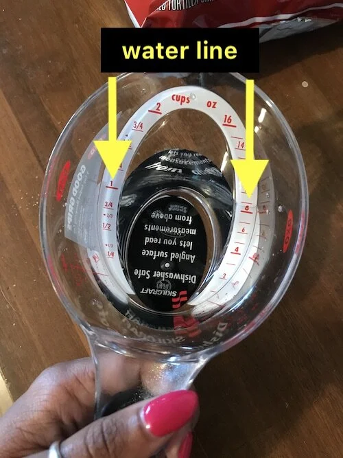 Picture of my brother’s clear, plastic measuring cup (from the top) showing the water measurement.