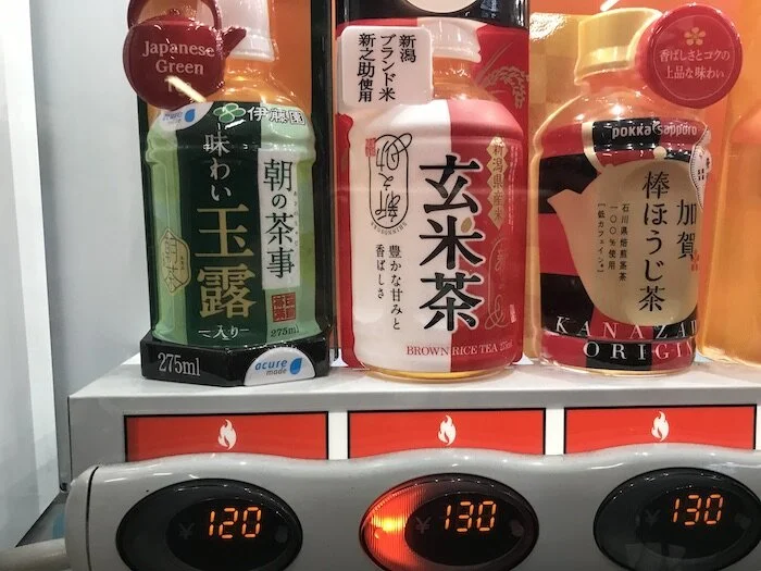 Image of beverages with an icon that looks like a flame (with a red background) beneath each drink. These are hot beverages.