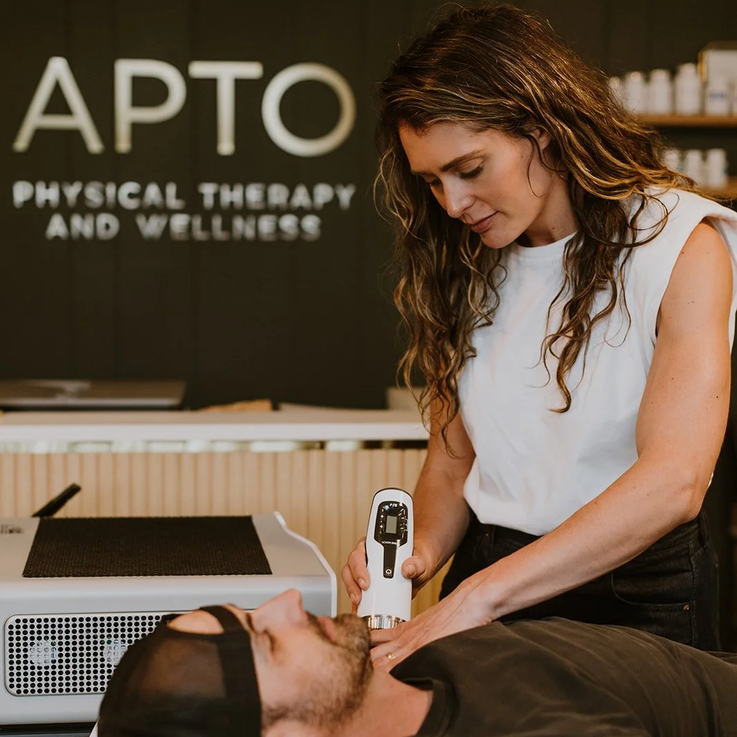 Physical Therapist performing focused shock wave therapy for shoulder pain.