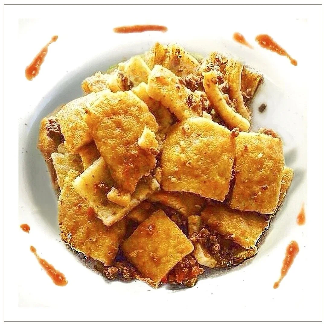 testaroli della lunigiana con ragù di cinghiale