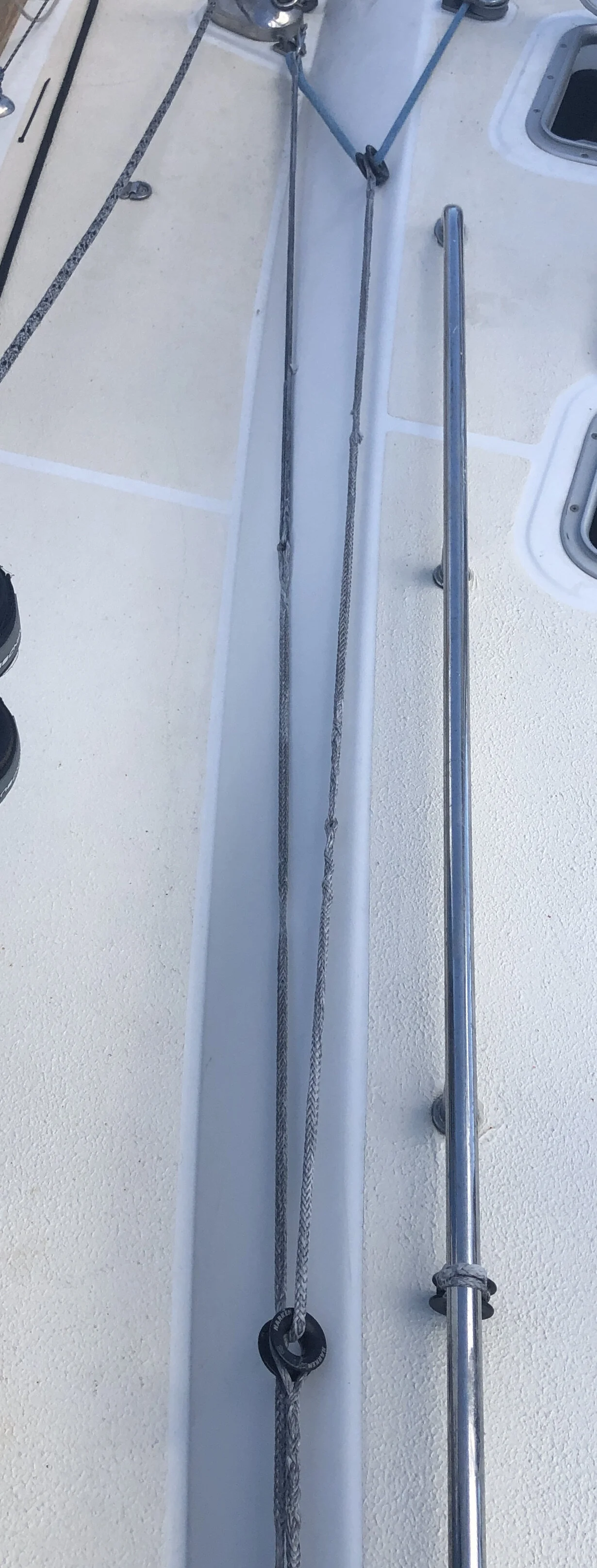 A 4:1 tackle made of dyneema line and low friction rings keeps the high load of the stay inside the area bounded by the shroud chainplates and the forestay. Once tensioned, the spinnaker down-haul can  be removed if a multi wrap of thin dyneema is u…