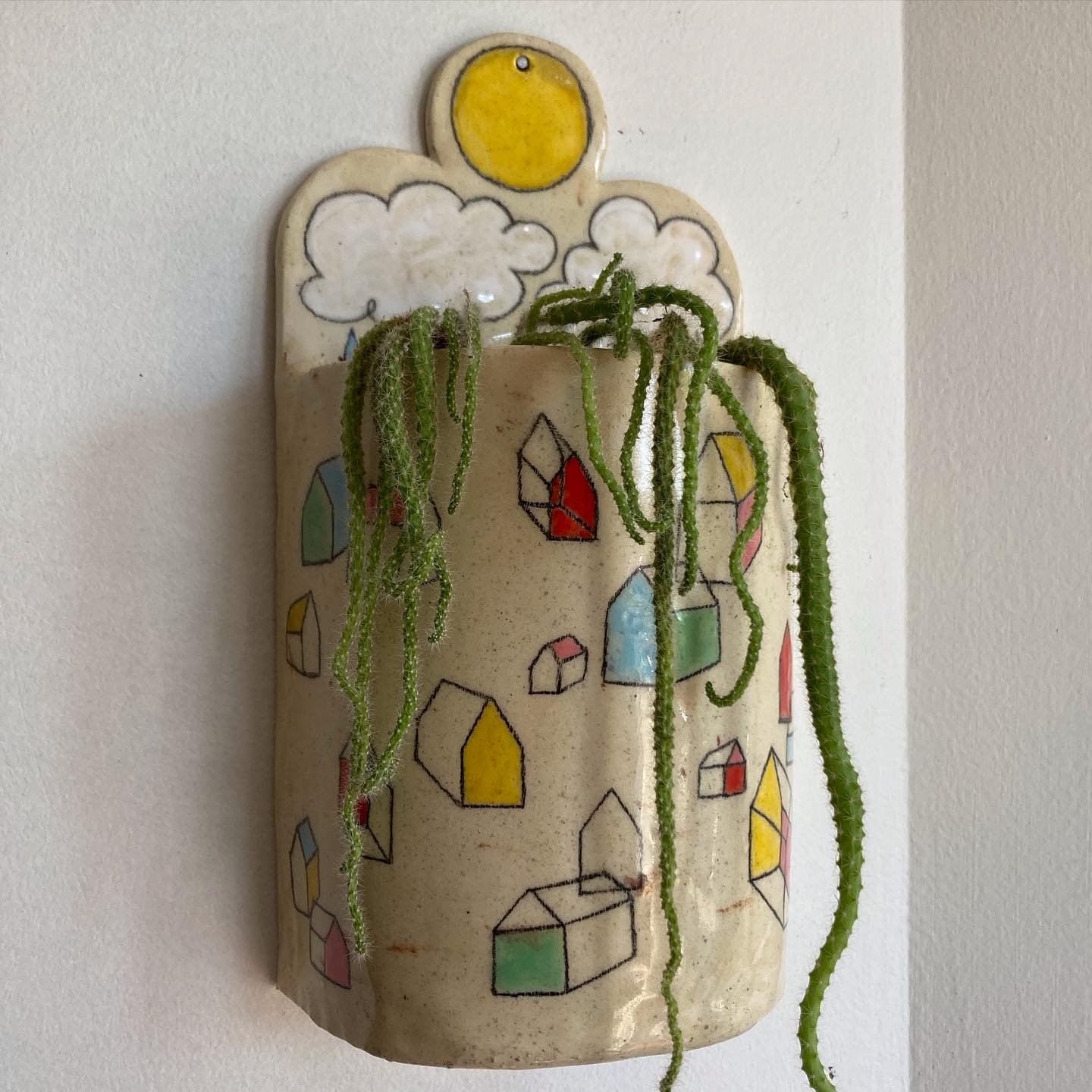 uh oh&hellip;. i think I might&rsquo;ve made my favorite ceramic piece yet?? 
.
.
.
.
.
.
.
.
.
.
.
.
.
.
.
#ceramics #planter #clay #art #illustration #phillyartist #handbuiltceramics #handbuilding #houses #plants #clouds #sun #rain #iloveyou #didyo
